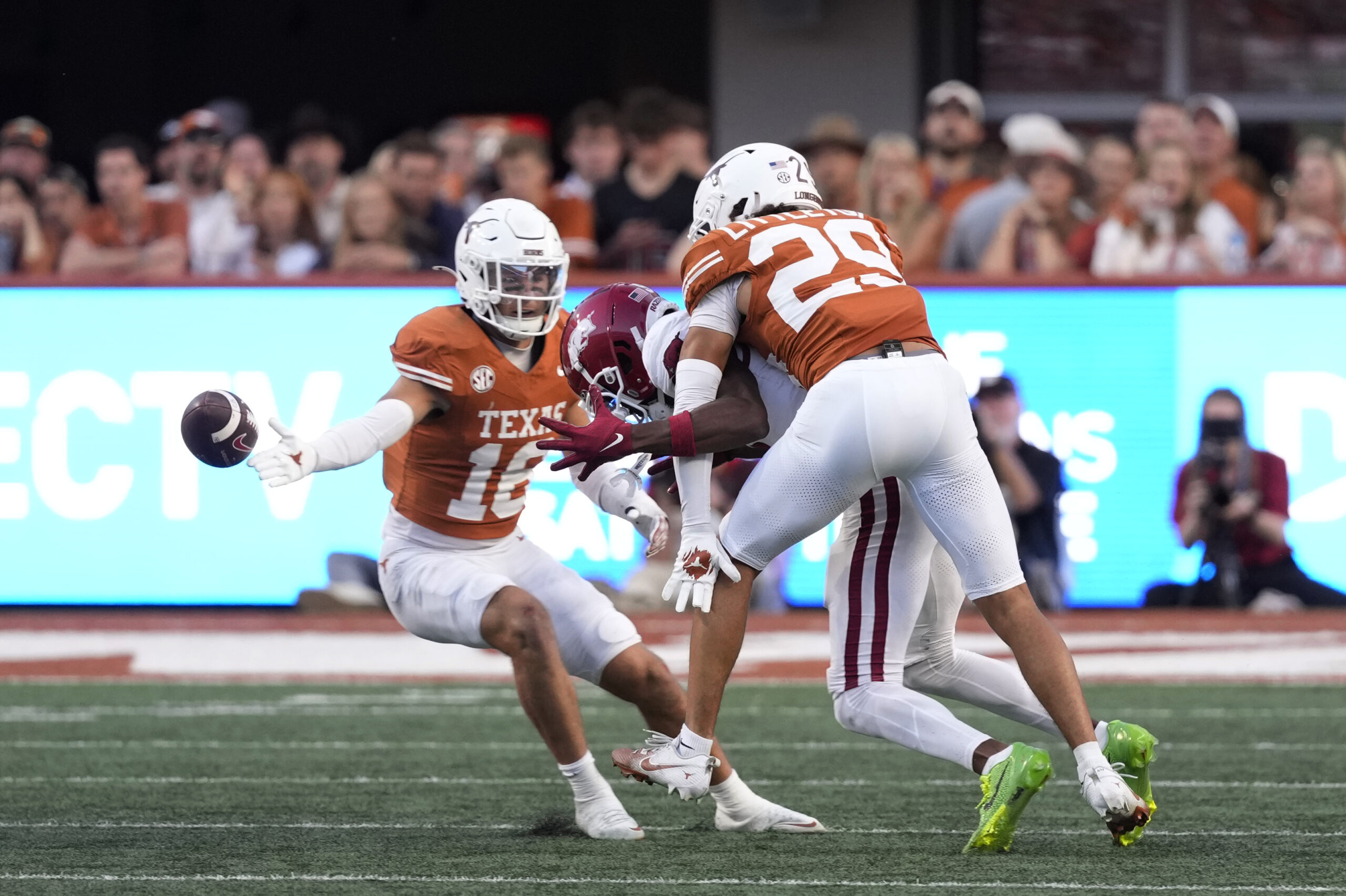 Nov 22, 2025; Austin, Texas, USA; Texas Longhorns defensive back Graceson Littleton (29) breaks up a pass ahead teammate Michael Taaffe (16) during the second half against the Arkansas Razorbacks at Darrell K Royal-Texas Memorial Stadium. Mandatory Credit: Scott Wachter-Imagn Images