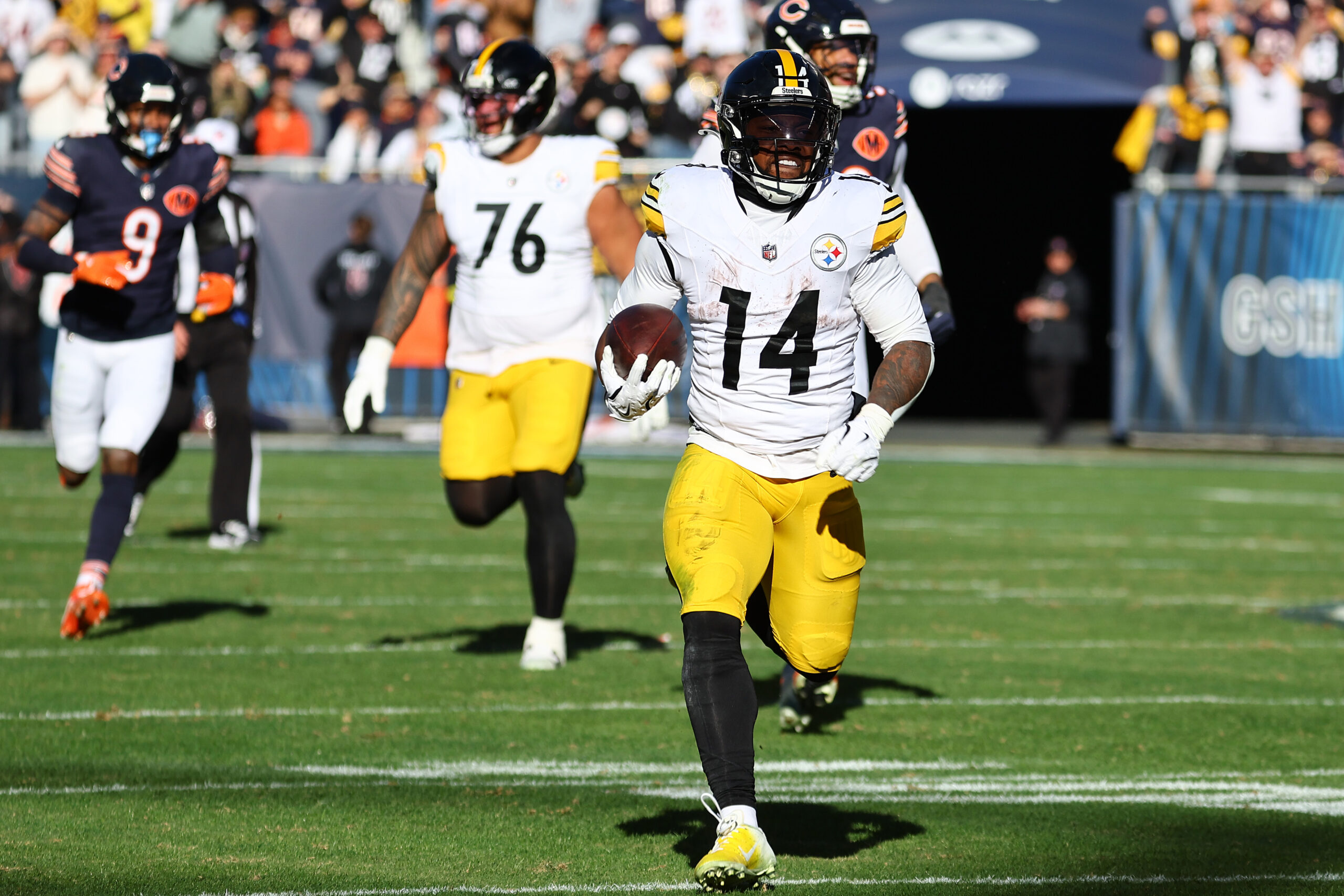 Nov 23, 2025; Chicago, Illinois, USA; Pittsburgh Steelers running back Kenneth Gainwell (14) rushes the ball against the Chicago Bears during the second half at Soldier Field. Mandatory Credit: Mike Dinovo-Imagn Images