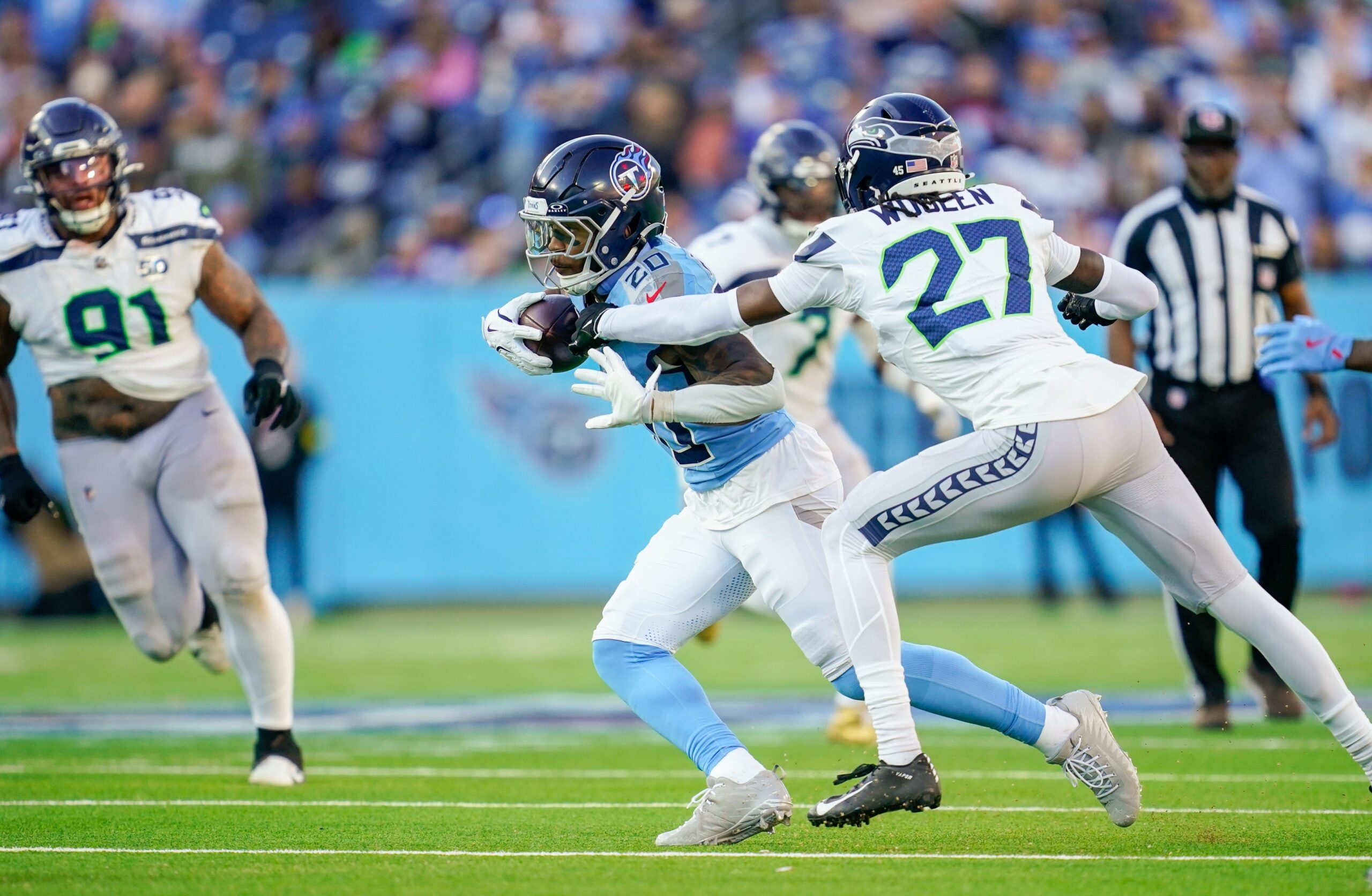 Nov 23, 2025; Nashville, Tennessee, USA; Tennessee Titans running back Tony Pollard (20) runs the ball during the fourth quarter against the Seattle Seahawks at Nissan Stadium. Mandatory Credit: Andrew Nelles-USA TODAY Network via Imagn Images