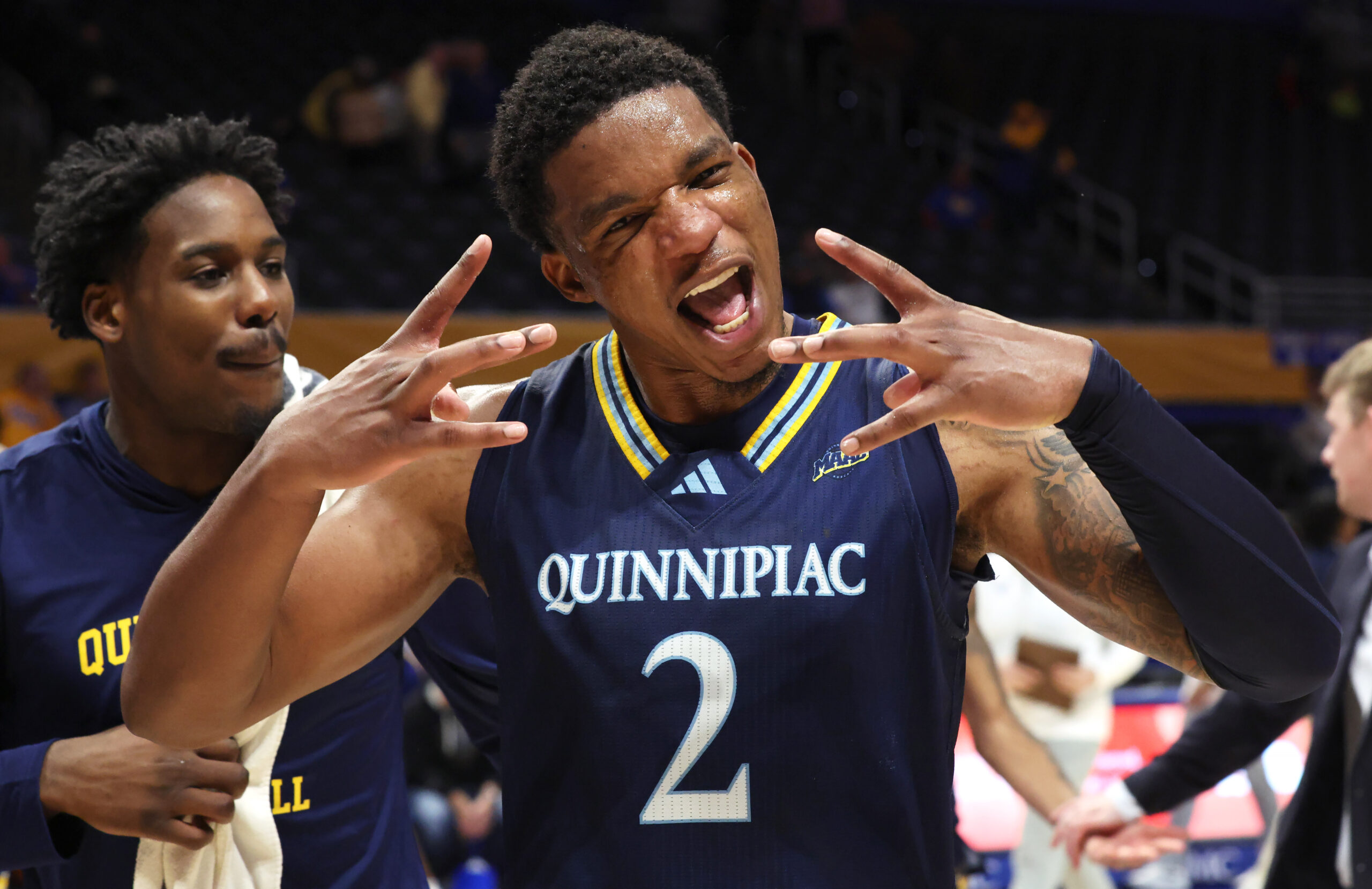 Nov 23, 2025; Pittsburgh, Pennsylvania, USA;  Quinnipiac Bobcats forward Amarri Monroe (2) celebrates after defeating the Pittsburgh Panthers at the Petersen Events Center. Mandatory Credit: Charles LeClaire-Imagn Images