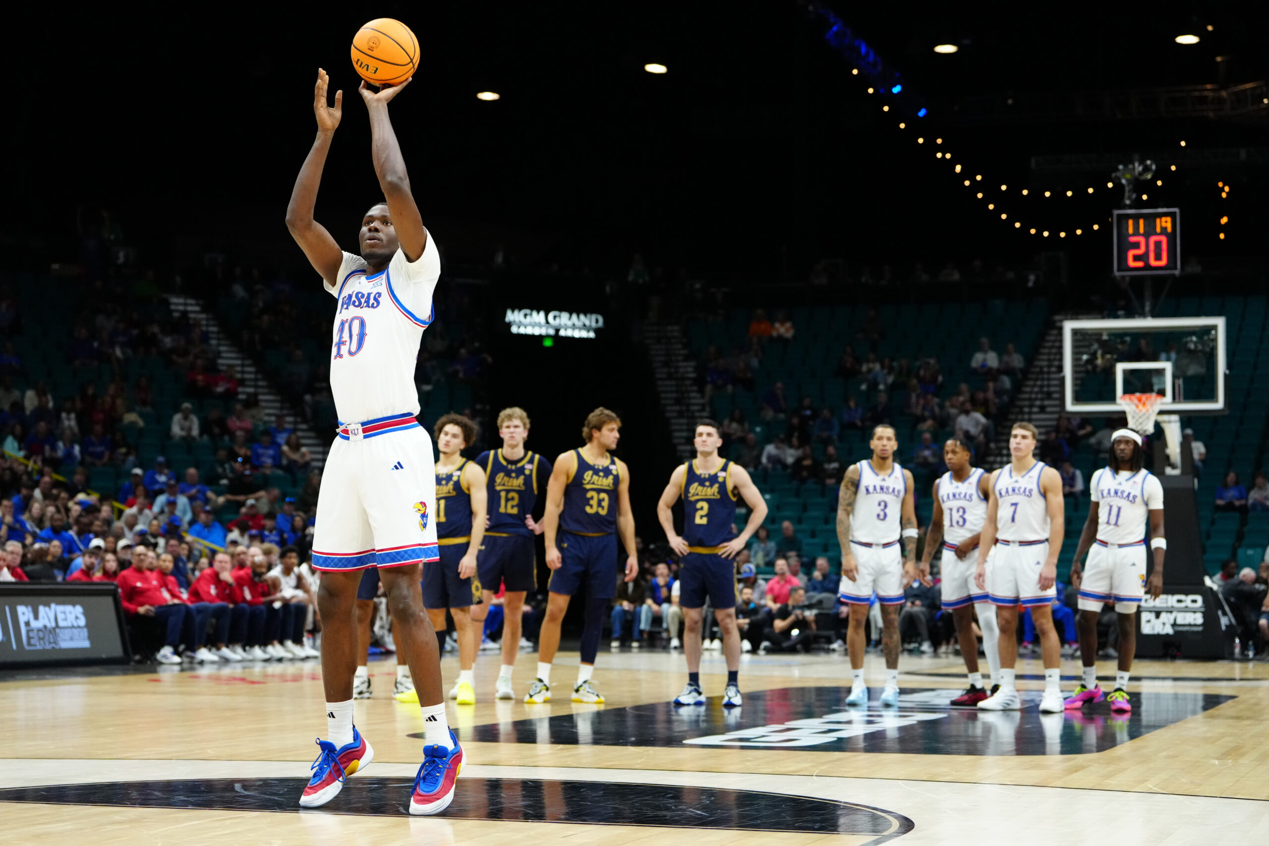 Nov 24, 2025; Las Vegas, Nevada, USA; Kansas Jayhawks forward Flory Bidunga (40) shoots technical foul free throws against the Notre Dame Fighting Irish during the first half in a 2025 Players Era Festival group play game at MGM Grand Garden Arena. Mandatory Credit: Stephen R. Sylvanie-Imagn Images