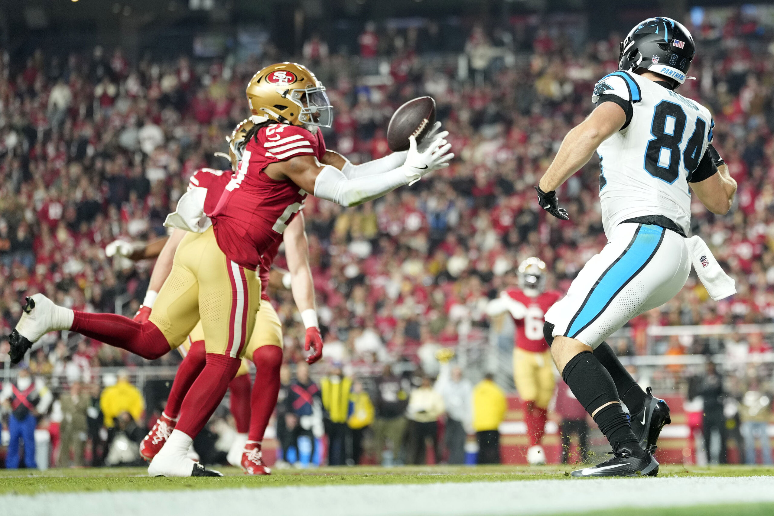 Nov 24, 2025; Santa Clara, California, USA; San Francisco 49ers safety Ji'Ayir Brown (27) makes an interception against the Carolina Panthers during the first half at Levi's Stadium. Mandatory Credit: Kyle Terada-Imagn Images