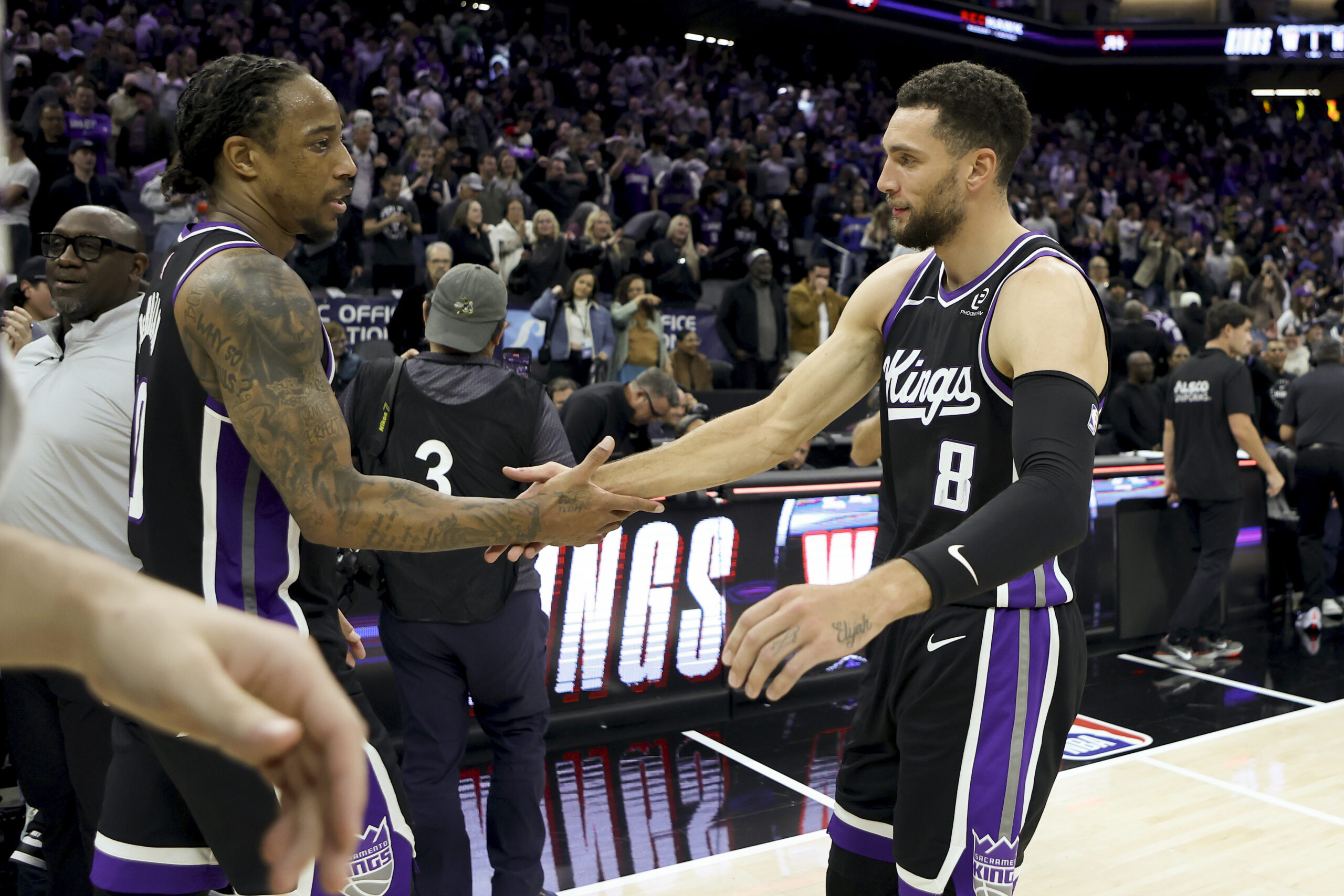 Nov 24, 2025; Sacramento, California, USA; Sacramento Kings forward DeMar DeRozan (10) and guard Zach LaVine (8) celebrate at mid court after defeating the Minnesota Timberwolves at Golden 1 Center. Mandatory Credit: Dennis Lee-Imagn Images
