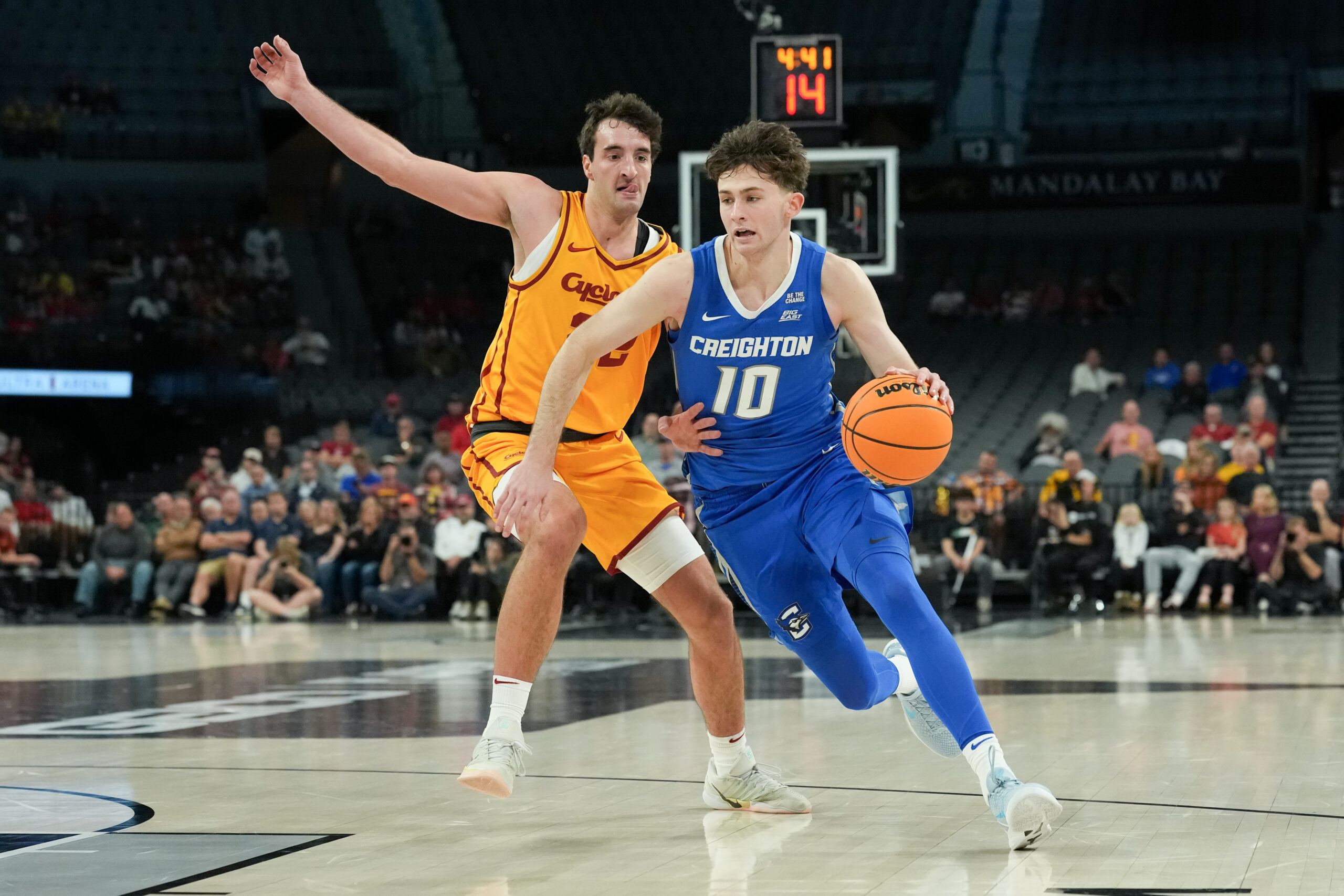 Nov 25, 2025; Las Vegas, Nevada, USA; Creighton Bluejays guard Hudson Greer (10) drives to the basket defended by Iowa State Cyclones forward Milan Momcilovic (22) during the second half in a 2025 Players Era Festival group play game at Michelob Ultra Arena. Mandatory Credit: Kirby Lee-Imagn Images
