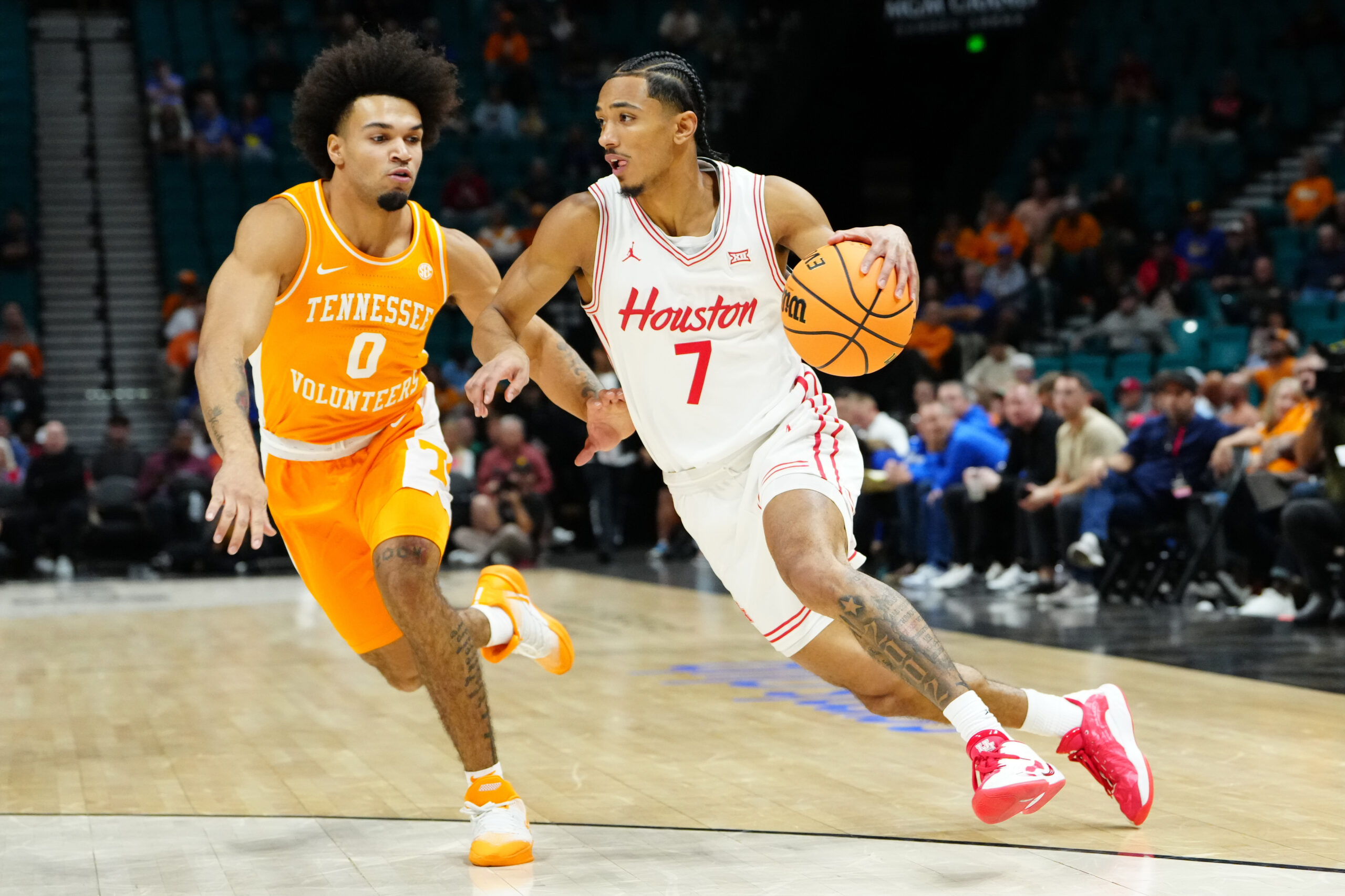 Nov 25, 2025; Las Vegas, NV, USA; Houston Cougars guard Milos Uzan (7) drives to the basket against Tennessee Volunteers guard Ja'Kobi Gillespie (0) in a 2025 Players Era Festival group play game during the first half at MGM Grand Garden Arena. Mandatory Credit: Stephen R. Sylvanie-Imagn Images