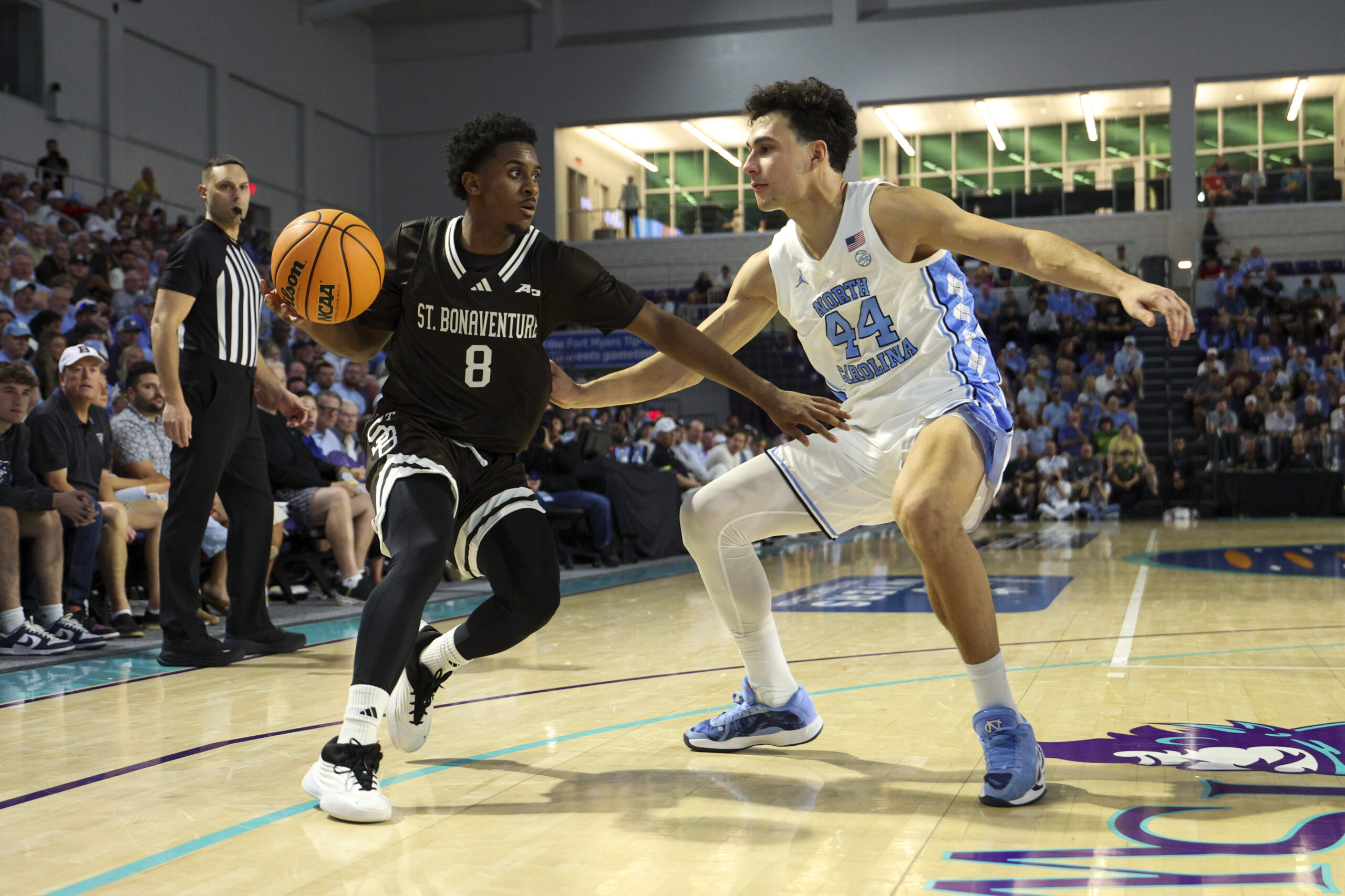 Nov 25, 2025; Fort Myers, Florida, USA; St. Bonaventure Bonnies guard Darryl Simmons II (8) is guarded by North Carolina Tar Heels guard Luka Bogavac (44) in the second half at Suncoast Credit Union Arena. Mandatory Credit: Nathan Ray Seebeck-Imagn Images