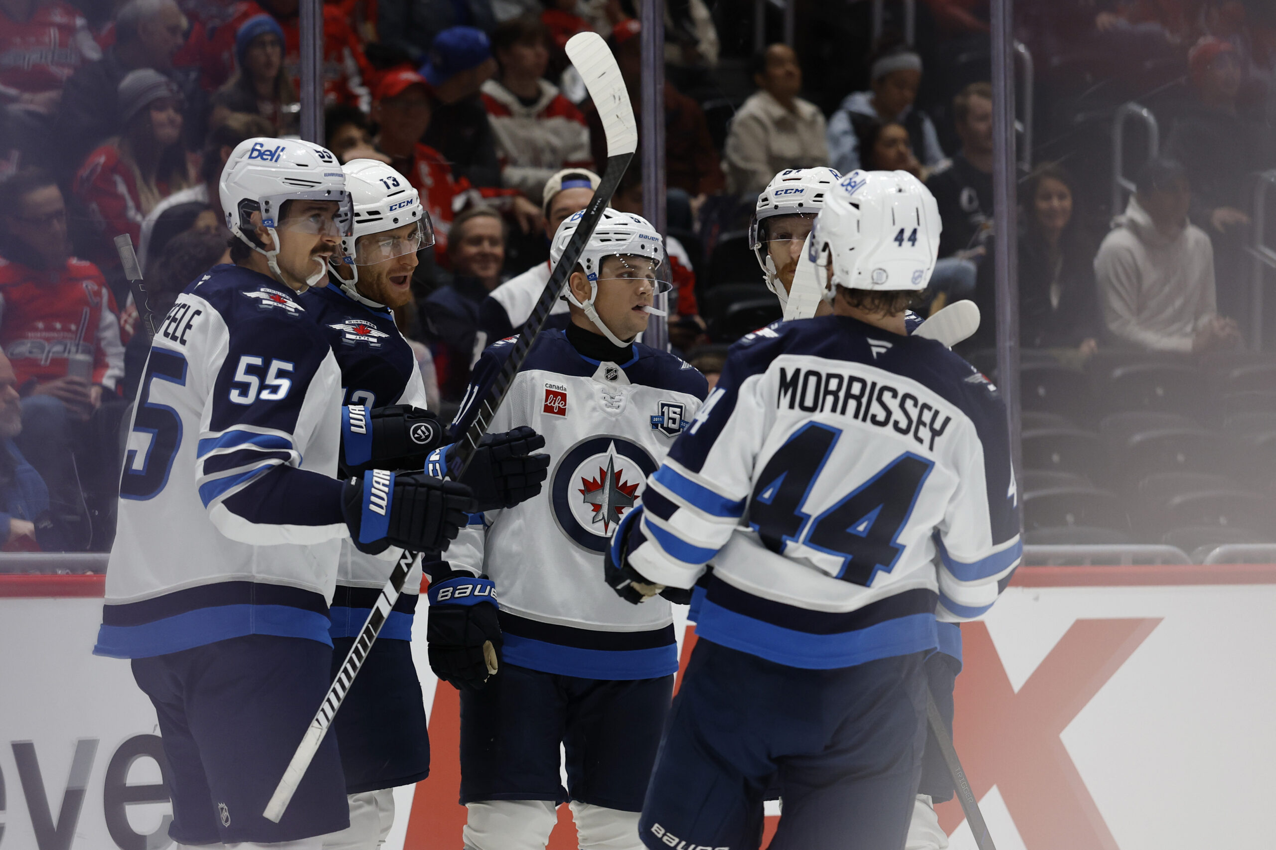 Nov 26, 2025; Washington, District of Columbia, USA; Winnipeg Jets center Gabriel Vilardi (13) celebrates with teammates after scoring a goal against the Washington Capitals during the second period at Capital One Arena. Mandatory Credit: Geoff Burke-Imagn Images