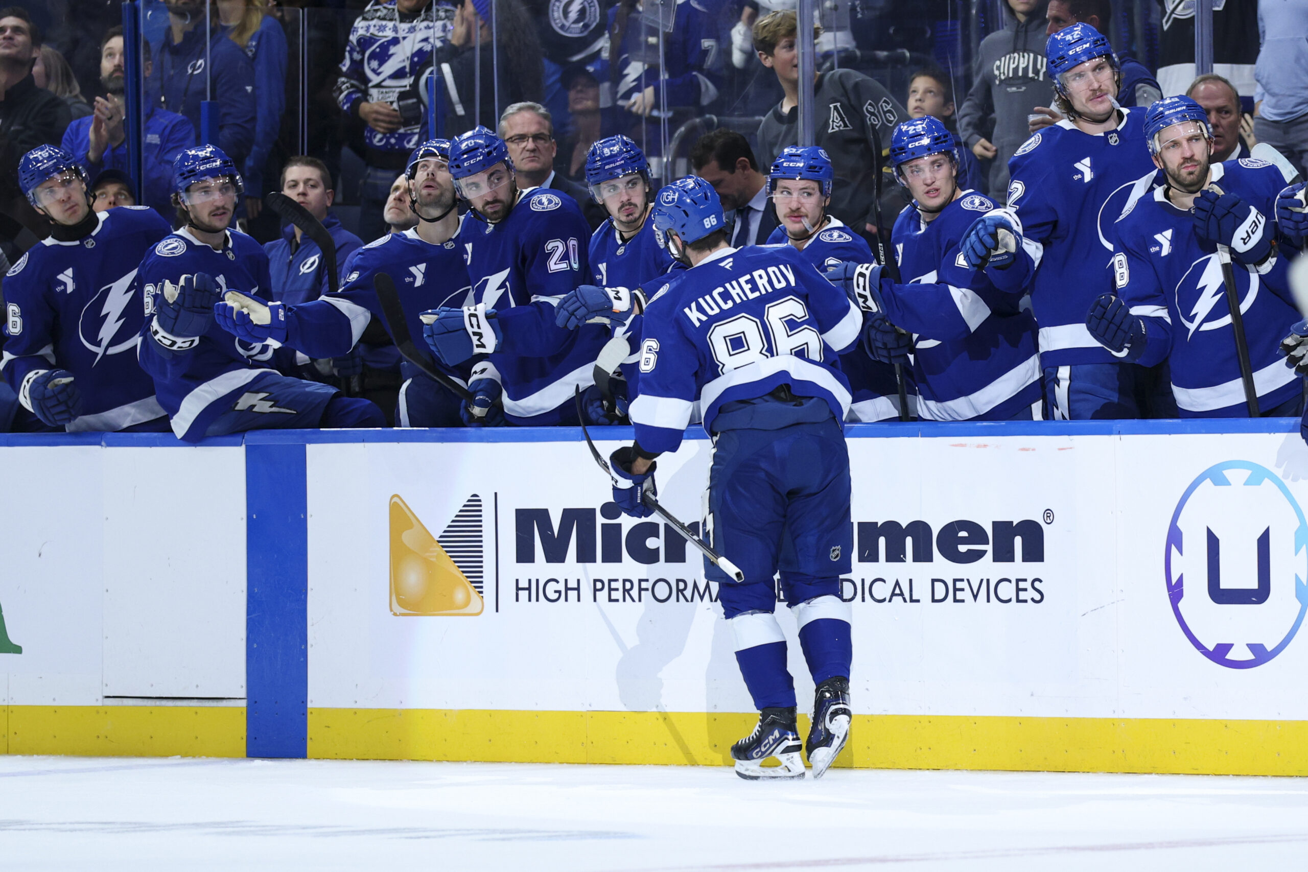 Nov 26, 2025; Tampa, Florida, USA; Tampa Bay Lightning right wing Nikita Kucherov (86) is congratulated after scoring a goal against the Calgary Flames in the third period at Benchmark International Arena. Mandatory Credit: Nathan Ray Seebeck-Imagn Images
