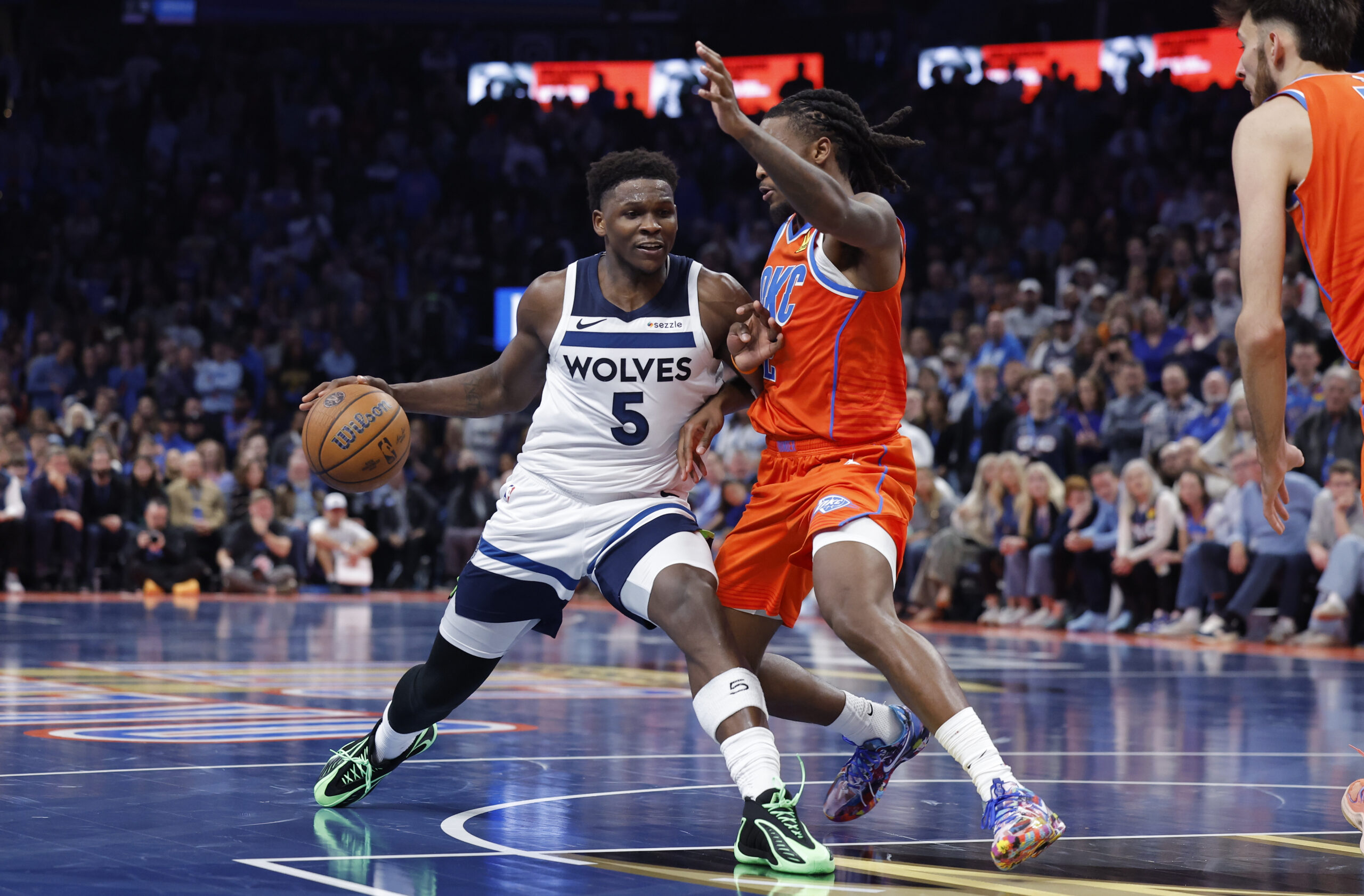 Nov 26, 2025; Oklahoma City, Oklahoma, USA; Minnesota Timberwolves guard Anthony Edwards (5) moves to the basket beside Oklahoma City Thunder guard Cason Wallace (22) during the second half at Paycom Center. Mandatory Credit: Alonzo Adams-Imagn Images