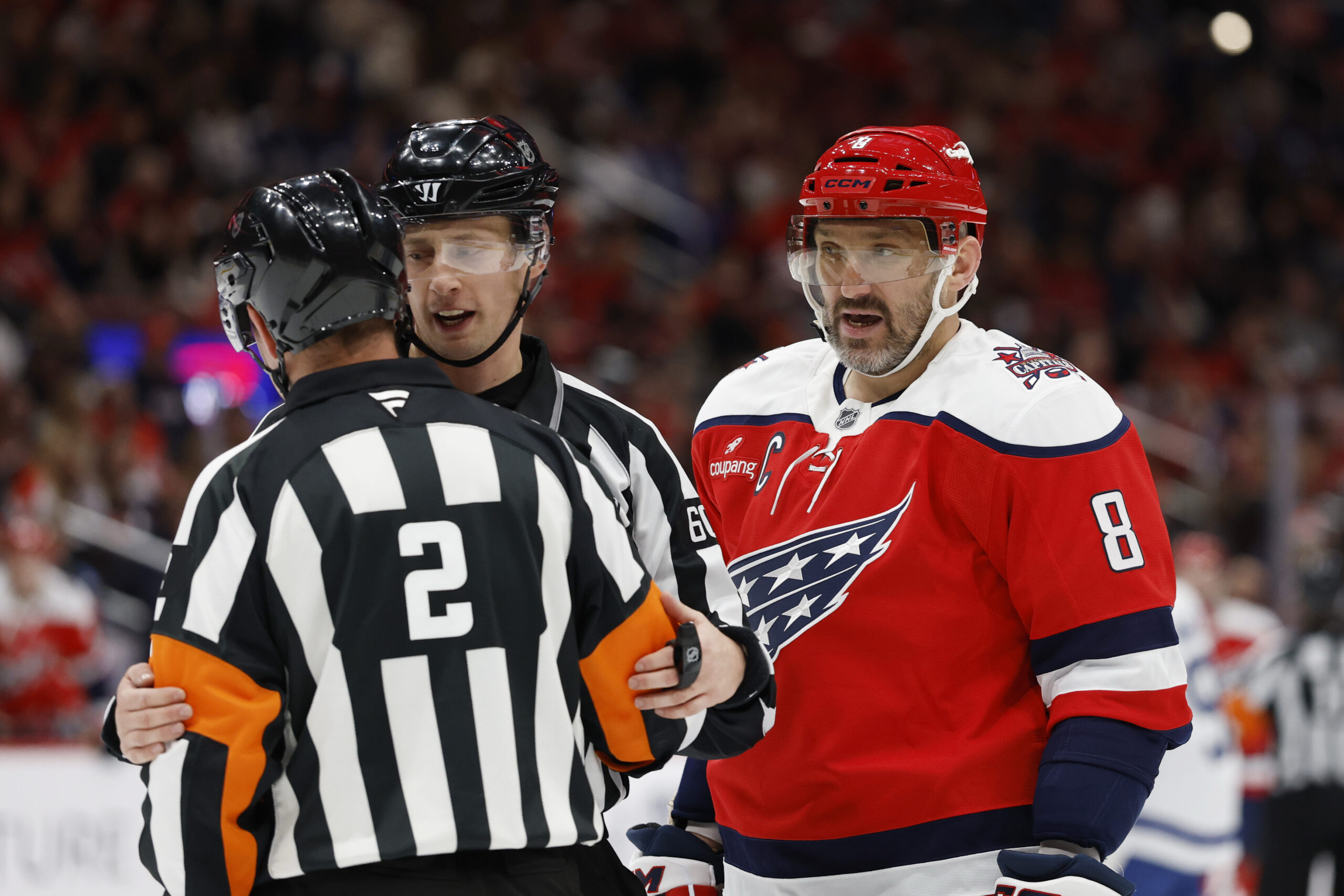 Nov 28, 2025; Washington, District of Columbia, USA; Washington Capitals left wing Alex Ovechkin (8) argues with referee Jon McIsaac (2) during a timeout against the Toronto Maple Leafs during the second period at Capital One Arena. Mandatory Credit: Geoff Burke-Imagn Images