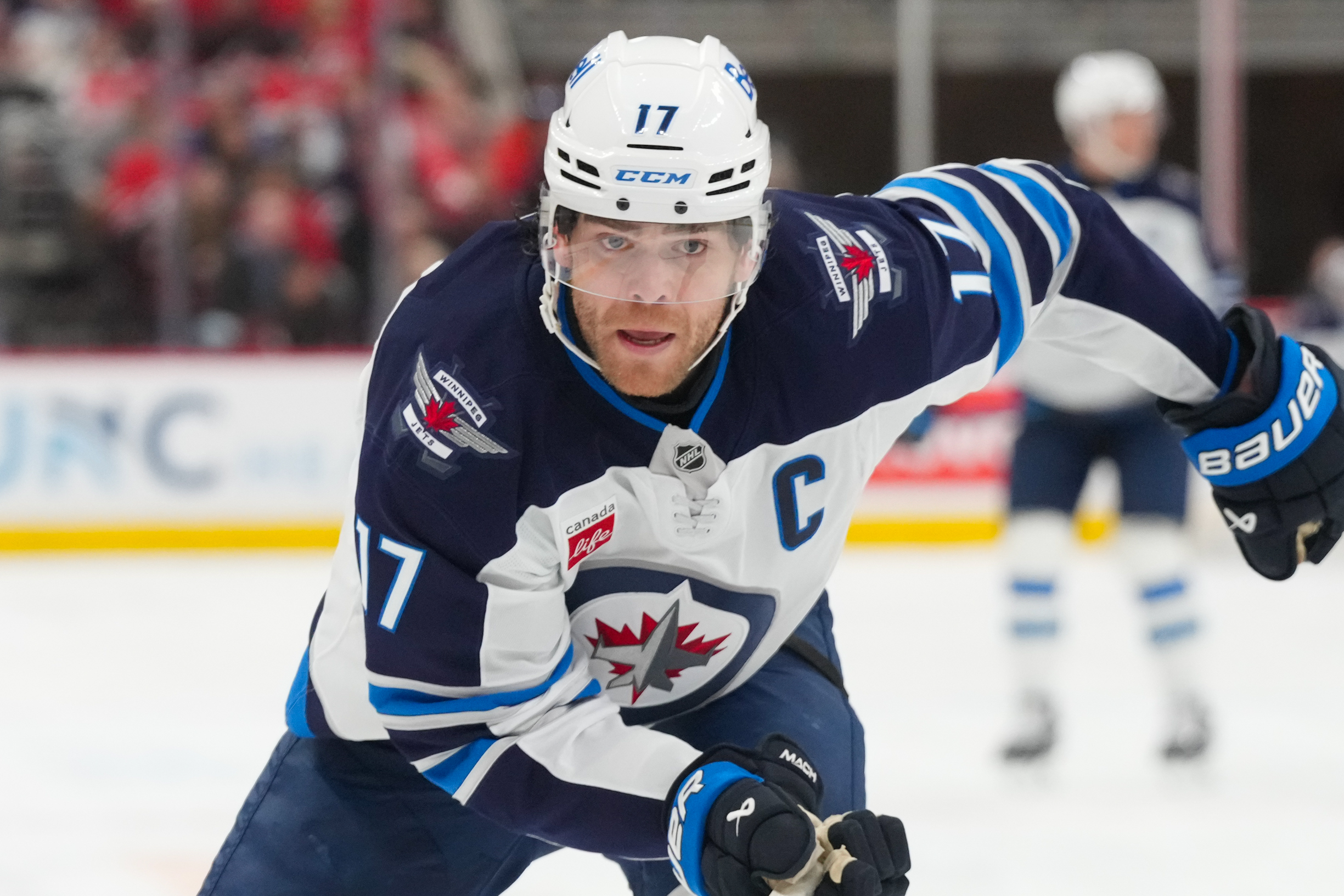 Nov 28, 2025; Raleigh, North Carolina, USA;  Winnipeg Jets center Adam Lowry (17) skates against the Carolina Hurricanes during the second period at Lenovo Center. Mandatory Credit: James Guillory-Imagn Images
