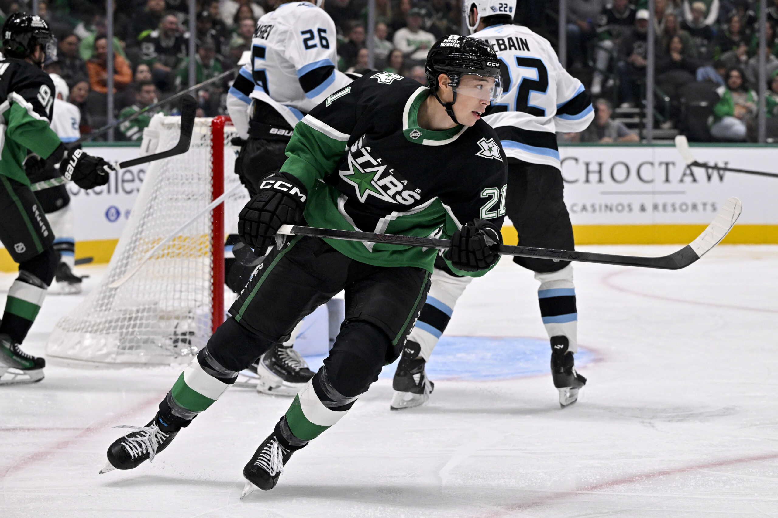 Nov 28, 2025; Dallas, Texas, USA; Dallas Stars left wing Jason Robertson (21) skates against the Utah Mammoth during the second period at the American Airlines Center. Mandatory Credit: Jerome Miron-Imagn Images