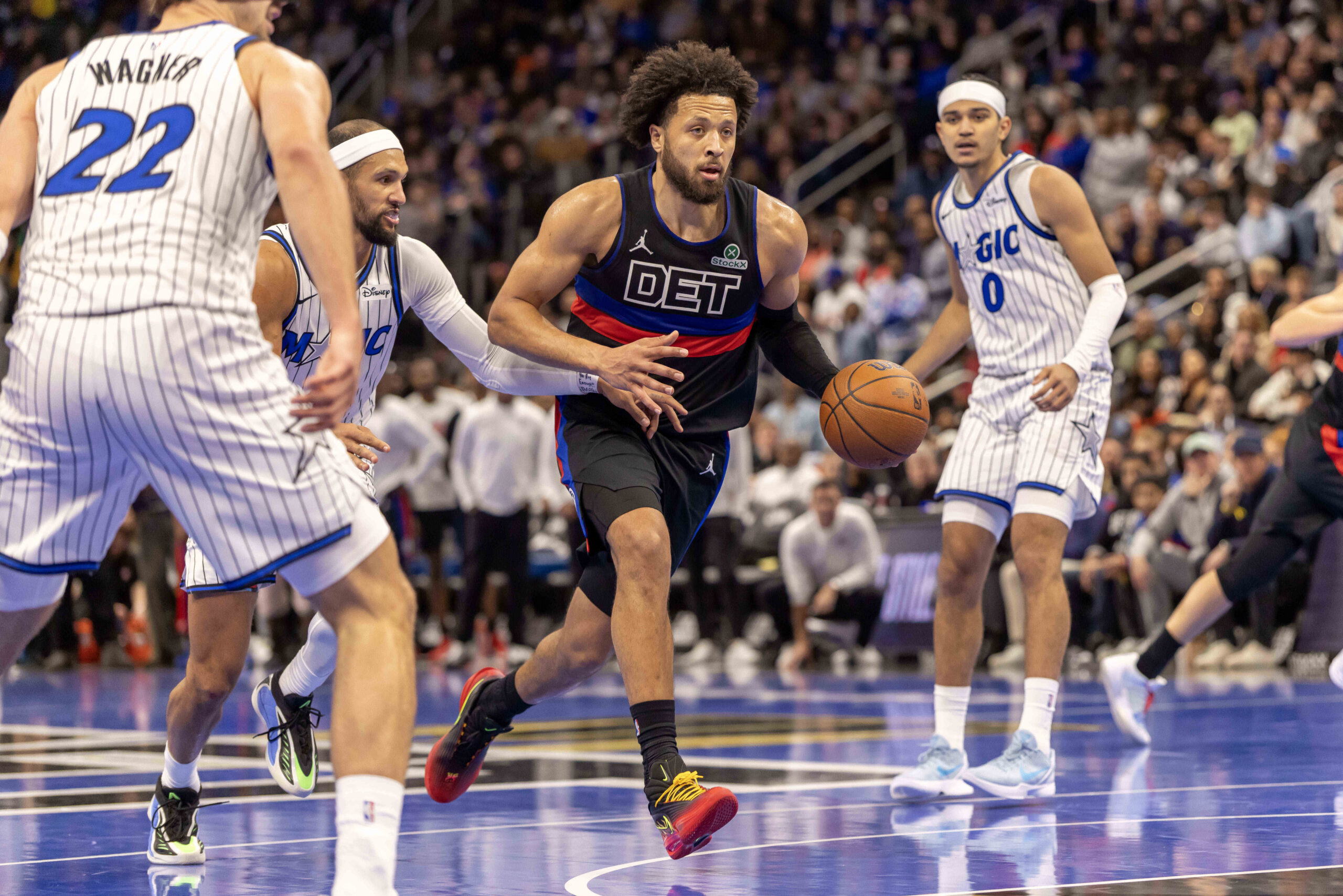 Nov 28, 2025; Detroit, Michigan, USA; Detroit Pistons guard Cade Cunningham (2) moves the ball up court against the Orlando Magic in the second half of the annual in-season NBA Cup tournament at Little Caesars Arena. Mandatory Credit: David Reginek-Imagn Images