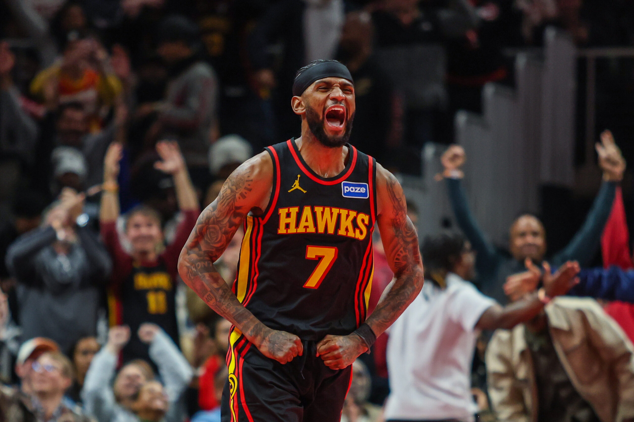 Nov 28, 2025; Atlanta, Georgia, USA; Atlanta Hawks guard Nickeil Alexander-Walker (7) celebrates a basket against the Cleveland Cavaliers during the fourth quarter at State Farm Arena. Mandatory Credit: Jordan Godfree-Imagn Images