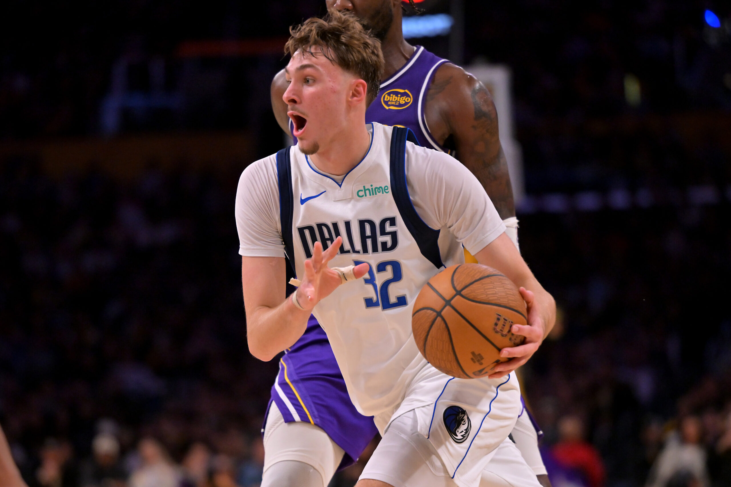 Nov 28, 2025; Los Angeles, California, USA;  Dallas Mavericks forward Cooper Flagg (32) drives to the basket in the second half against the Los Angeles Lakers at Crypto.com Arena. Mandatory Credit: Jayne Kamin-Oncea-Imagn Images