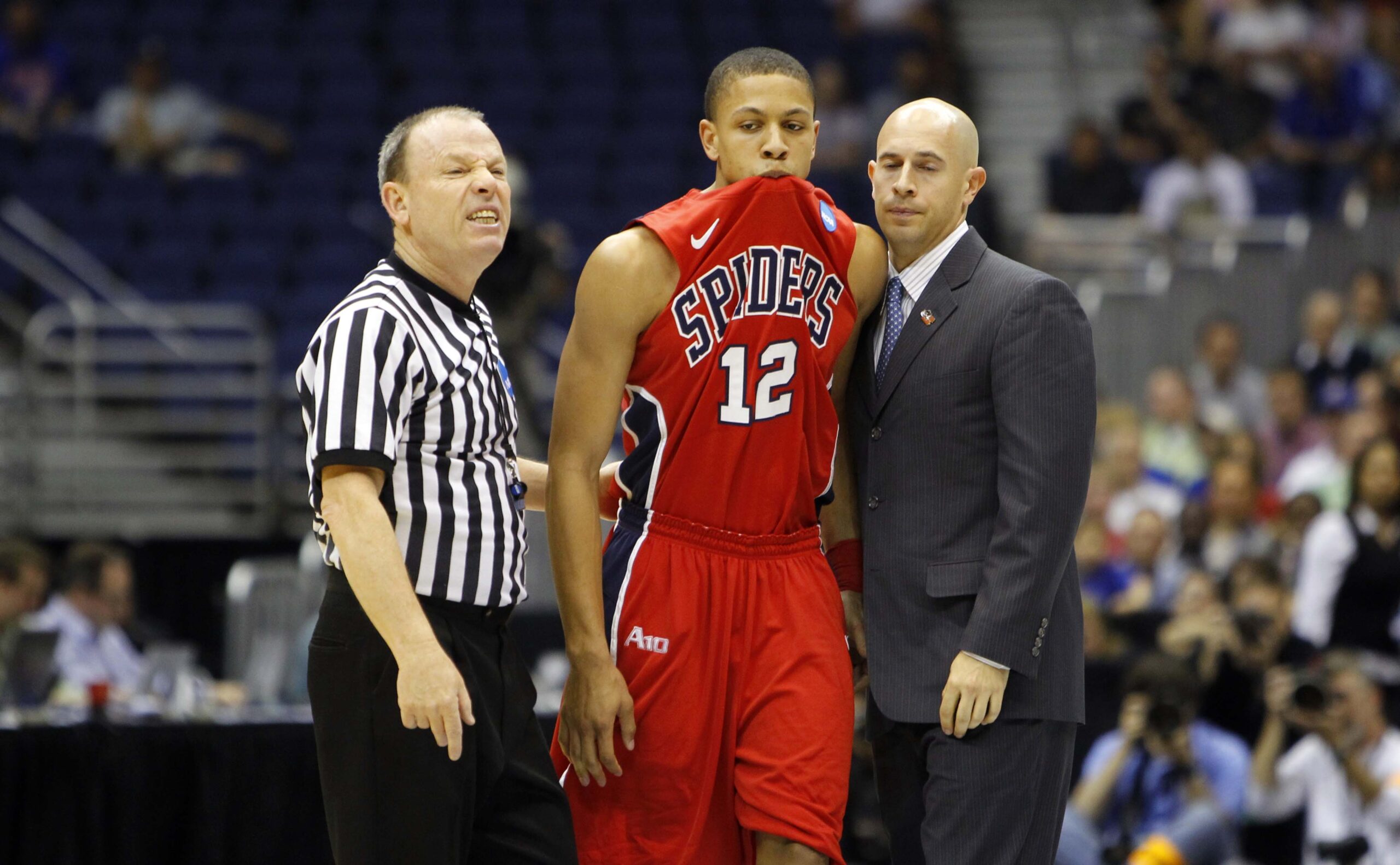 Mar 25, 2011; San Antonio, TX, USA; Richmond Spiders forward Kevin Smith (12) react after talking with a referee during the semifinals of the southwest regional of the 2011 NCAA men's basketball tournament against the Kansas Jayhawks at the Alamodome. Mandatory Credit: Bob Donnan-Imagn Images