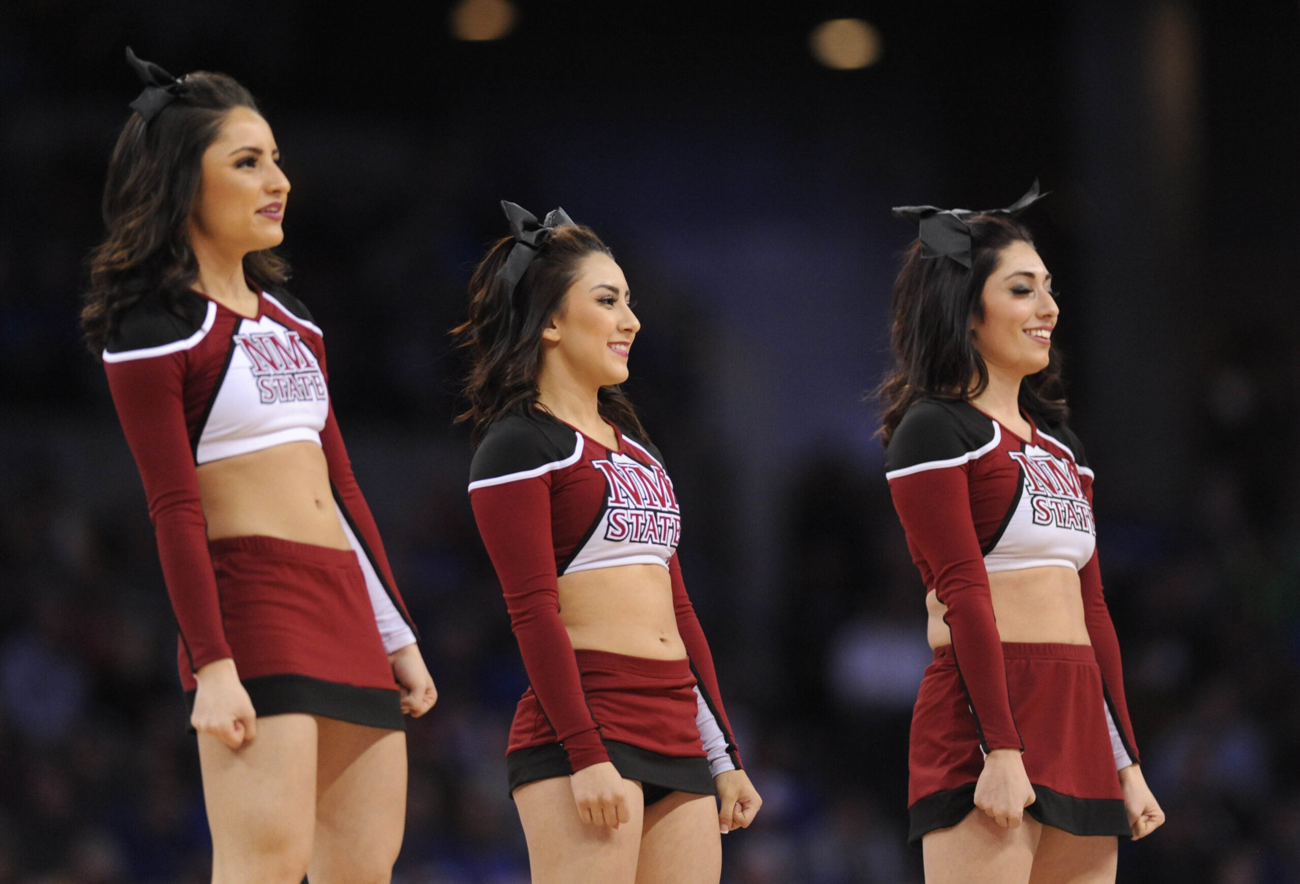 Mar 20, 2015; Omaha, NE, USA; New Mexico State Aggies cheerleaders perform during the first half in the second round of the 2015 NCAA Tournament against the Kansas Jayhawks at CenturyLink Center. Mandatory Credit: Steven Branscombe-Imagn Images