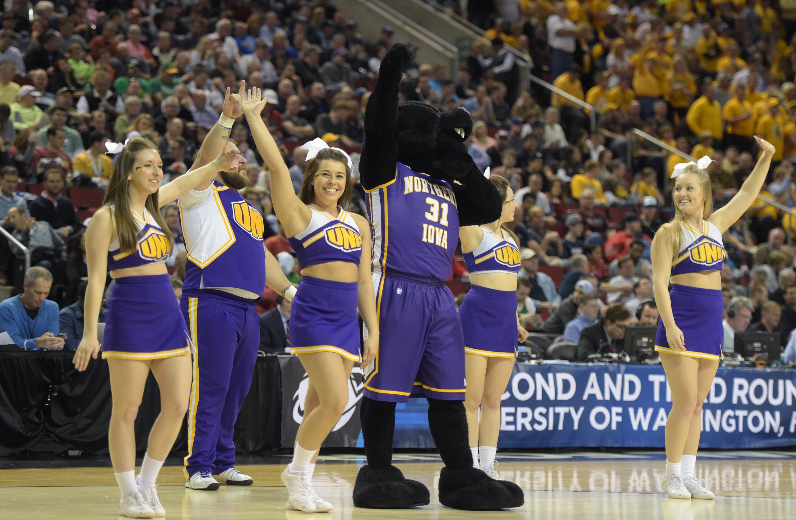 March 20, 2015; Seattle, WA, USA; Northern Iowa Panthers cheerleaders and mascot perform during the second half of the second round of the 2015 NCAA Tournament at KeyArena. Mandatory Credit: Kirby Lee-Imagn Images