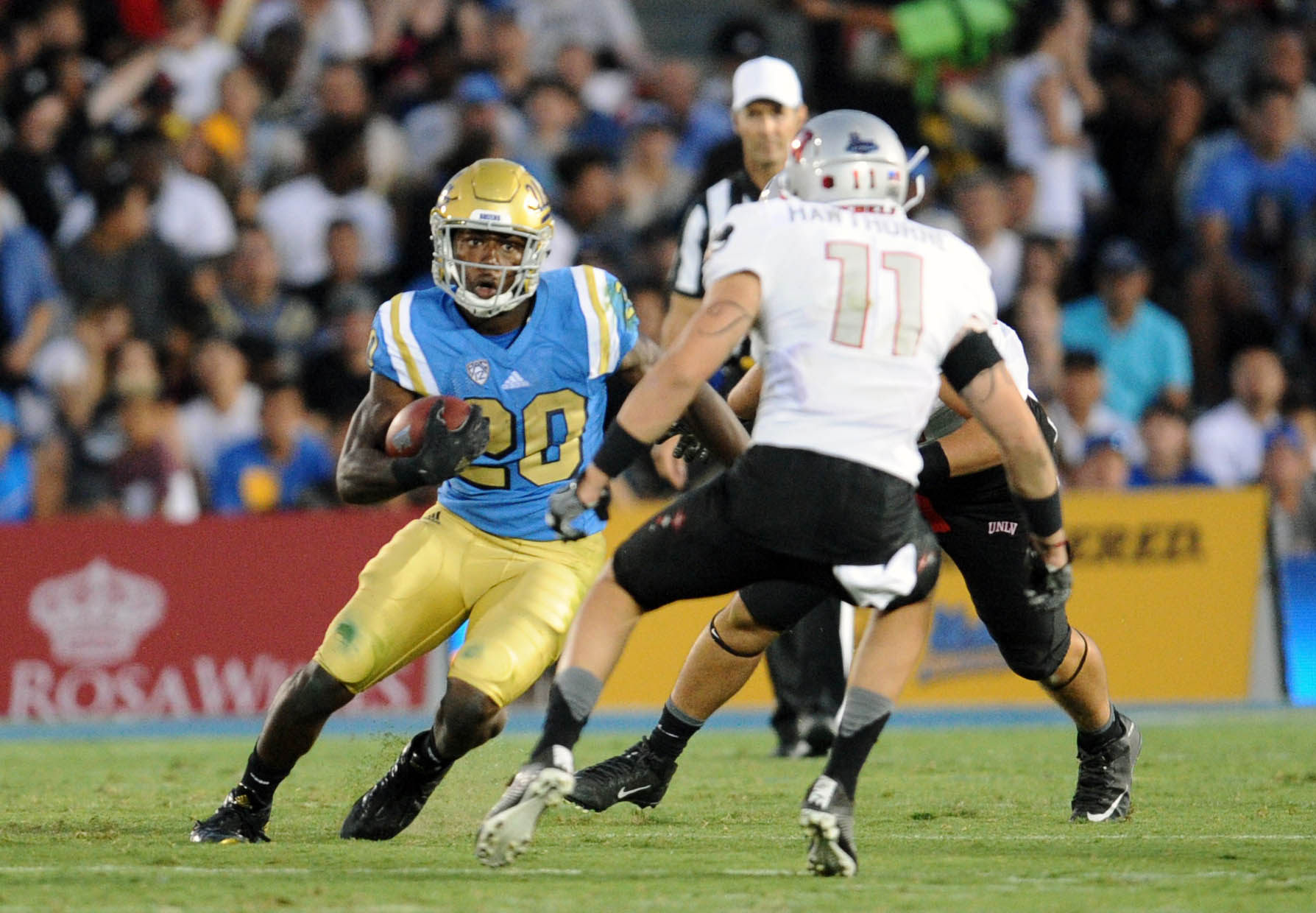September 10, 2016; Pasadena, CA, USA; UCLA Bruins running back Brandon Stephens (20) runs the ball against the UNLV Rebels during the second half at Rose Bowl. Mandatory Credit: Gary A. Vasquez-Imagn Images