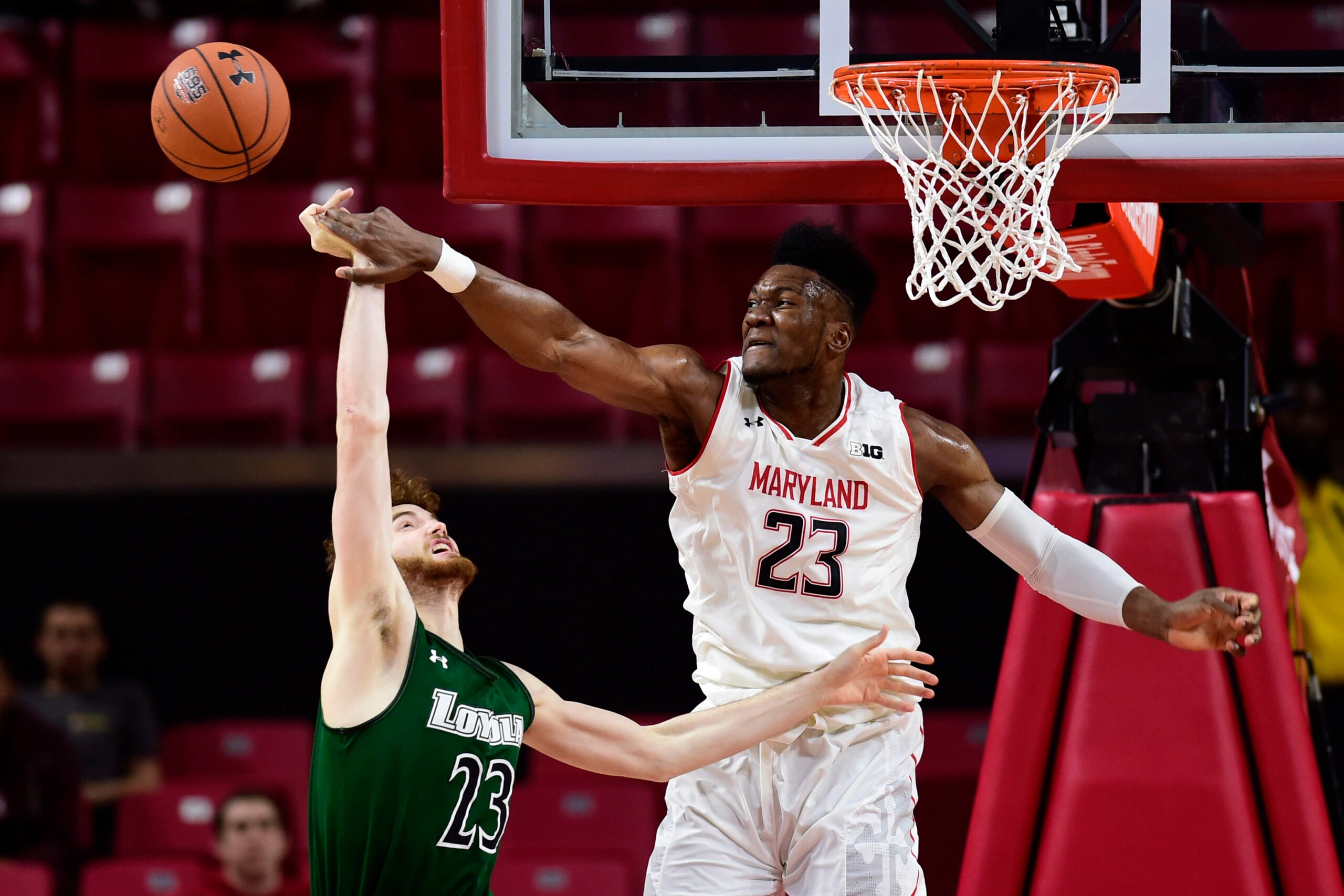 Dec 11, 2018; College Park, MD, USA; Maryland Terrapins forward Bruno Fernando (23) blocks Loyola (Md) Greyhounds forward Brent Holcombe (23) shot during the second half at XFINITY Center. Mandatory Credit: Tommy Gilligan-Imagn Images