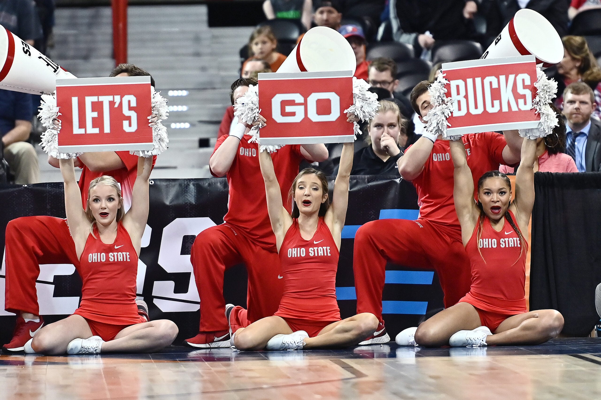 Mar 25, 2022; Spokane, WA, USA; Ohio State Buckeyes cheerleaders hold up sign against the Texas Longhorns in the Spokane regional semifinals of the women's college basketball NCAA Tournament at Spokane Veterans Memorial Arena. Mandatory Credit: James Snook-Imagn Images