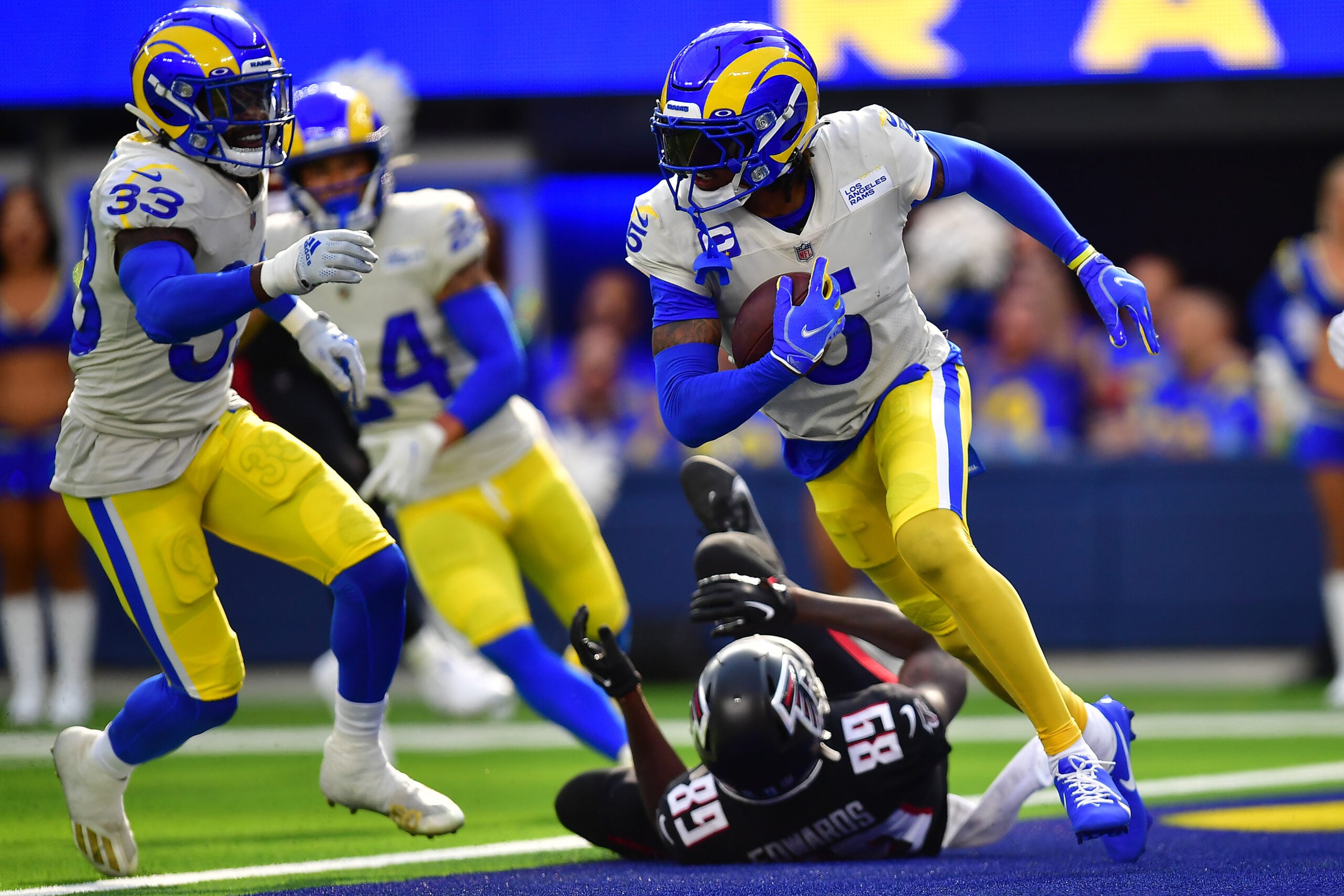 Sep 18, 2022; Inglewood, California, USA; Los Angeles Rams cornerback Jalen Ramsey (5) runs the ball after intercepting a pass intended for Atlanta Falcons wide receiver Bryan Edwards (89) during the second half at SoFi Stadium. Mandatory Credit: Gary A. Vasquez-Imagn Images