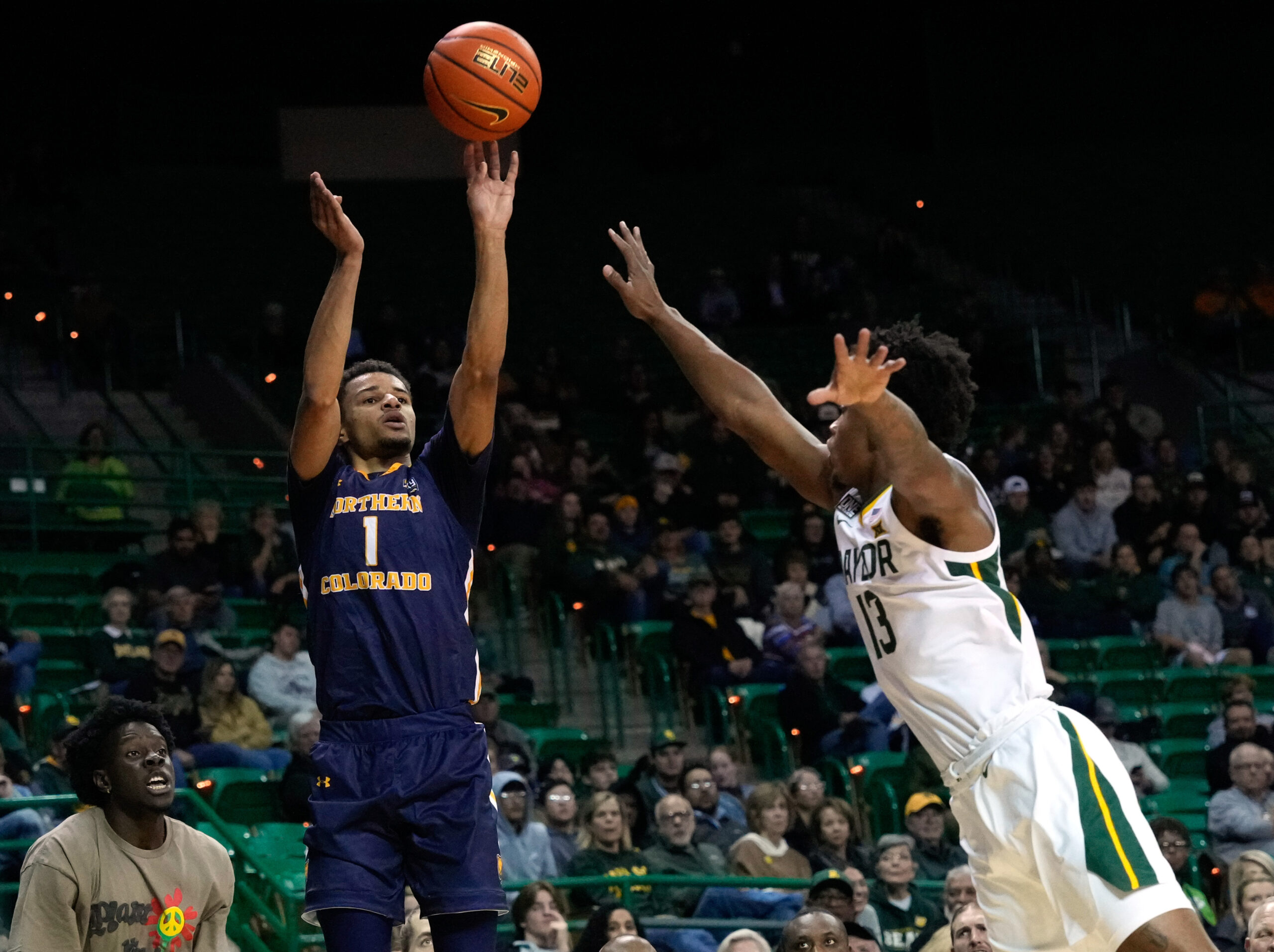 Nov 14, 2022; Waco, Texas, USA; Northern Colorado Bears guard Daylen Kountz (1) shoots against Baylor Bears guard Langston Love (13) during the first half at Ferrell Center. Mandatory Credit: Chris Jones-Imagn Images