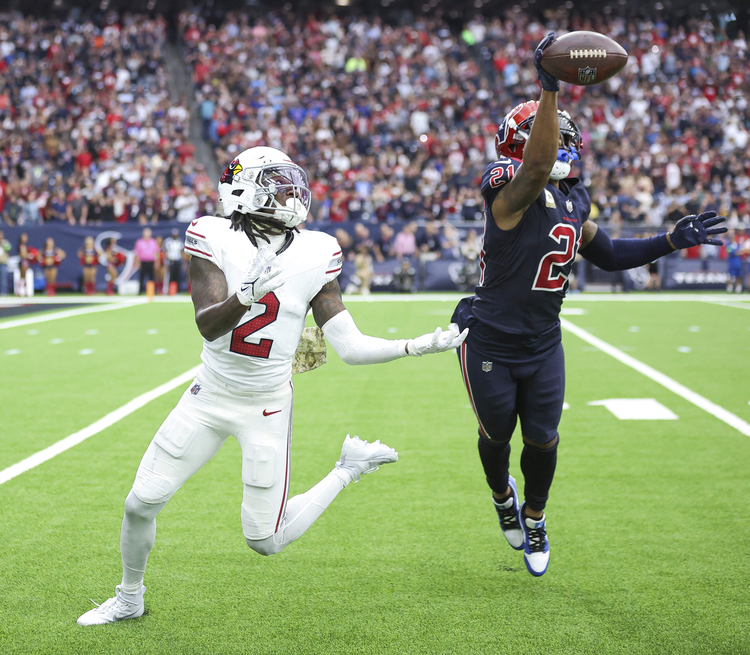 Nov 19, 2023; Houston, Texas, USA; Houston Texans cornerback Steven Nelson (21) deflects a pass intended for Arizona Cardinals wide receiver Marquise Brown (2) during the fourth quarter at NRG Stadium. Mandatory Credit: Troy Taormina-Imagn Images