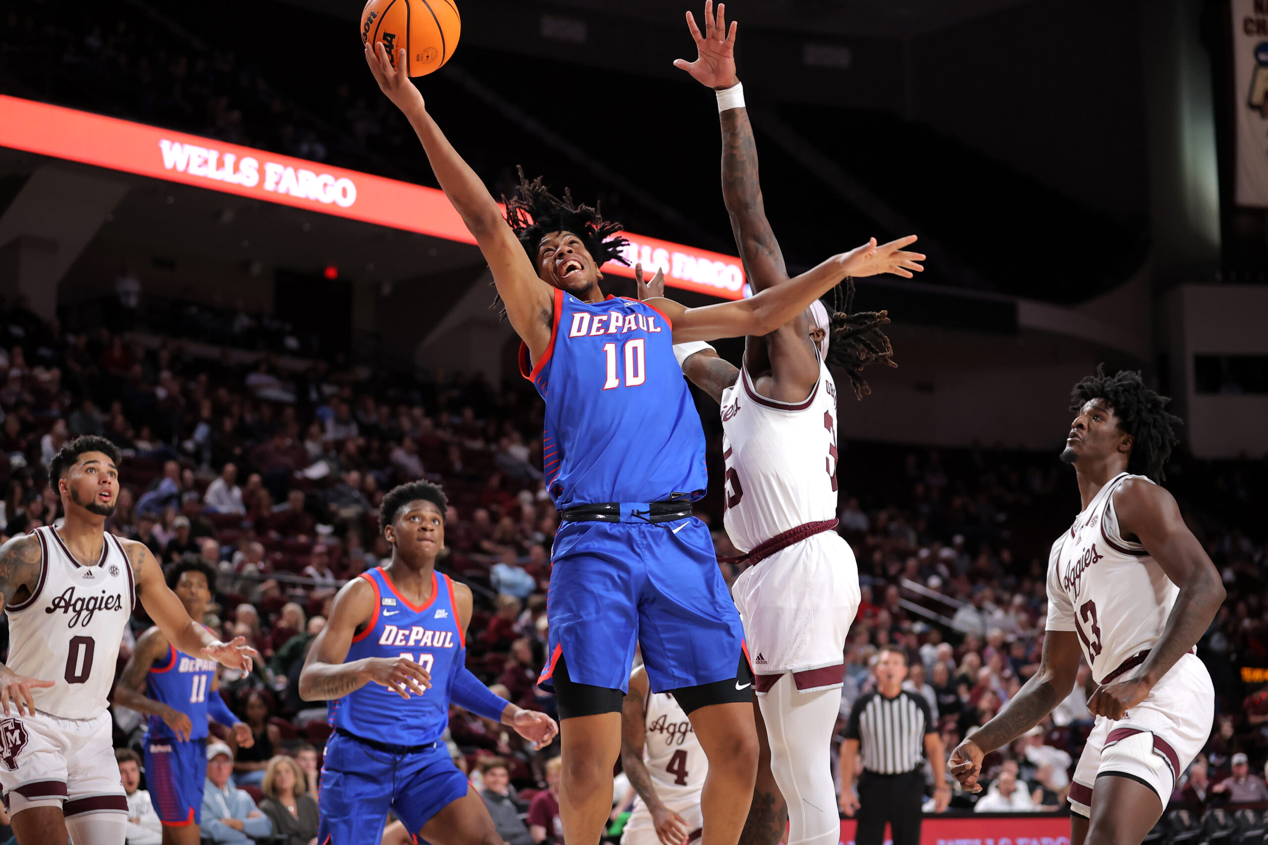 Dec 6, 2023; College Station, Texas, USA; DePaul Blue Demons guard Jaden Henley (10) attempts a layup against the Texas A&M Aggies during the second half at Reed Arena. Mandatory Credit: Erik Williams-Imagn Images