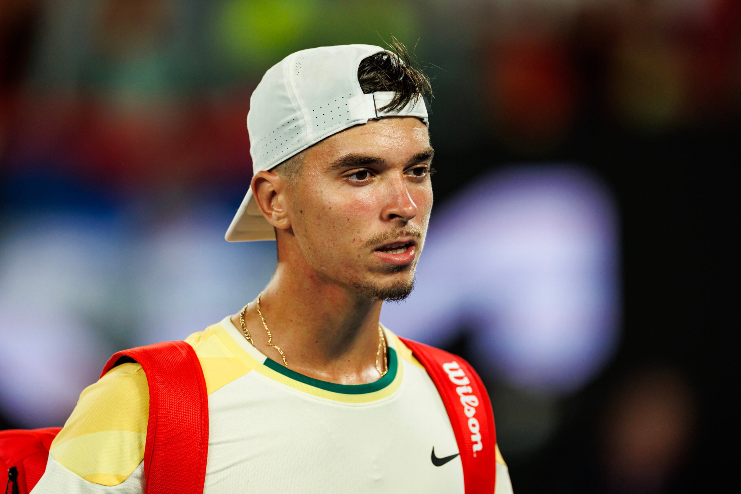 Jan 14, 2024; Melbourne, Victoria, Australia; Dino Prizmic of Croatia leaves Rod Laver Arena after losing to Novak Djokovic of Serbia in the first round of the men s singles. Mandatory Credit: Mike Frey-Imagn Images