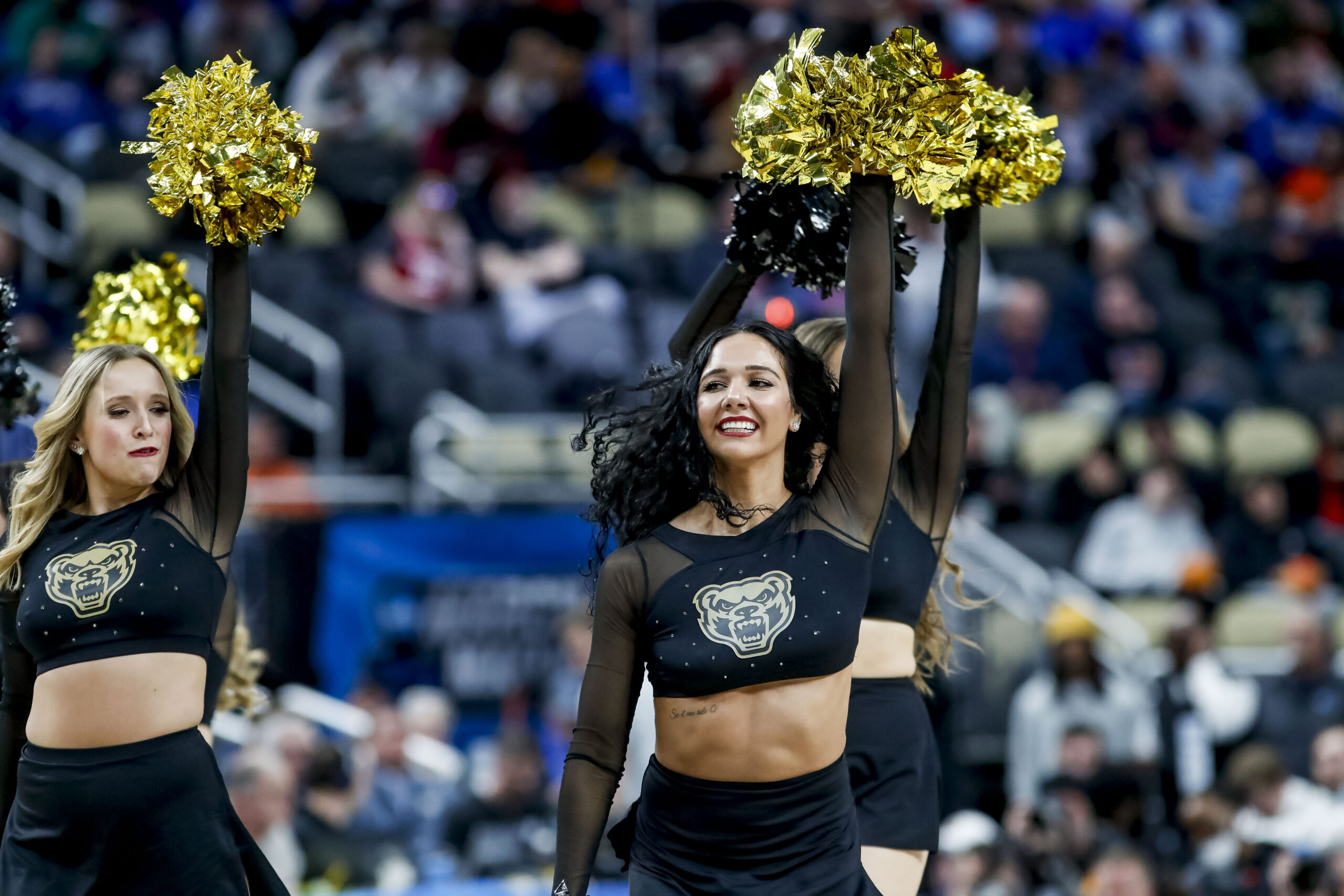 Mar 21, 2024; Pittsburgh, PA, USA; The Oakland Golden Grizzlies cheerleading squad during the second half in the first round of the 2024 NCAA Tournament at PPG Paints Arena. Mandatory Credit: Charles LeClaire-Imagn Images