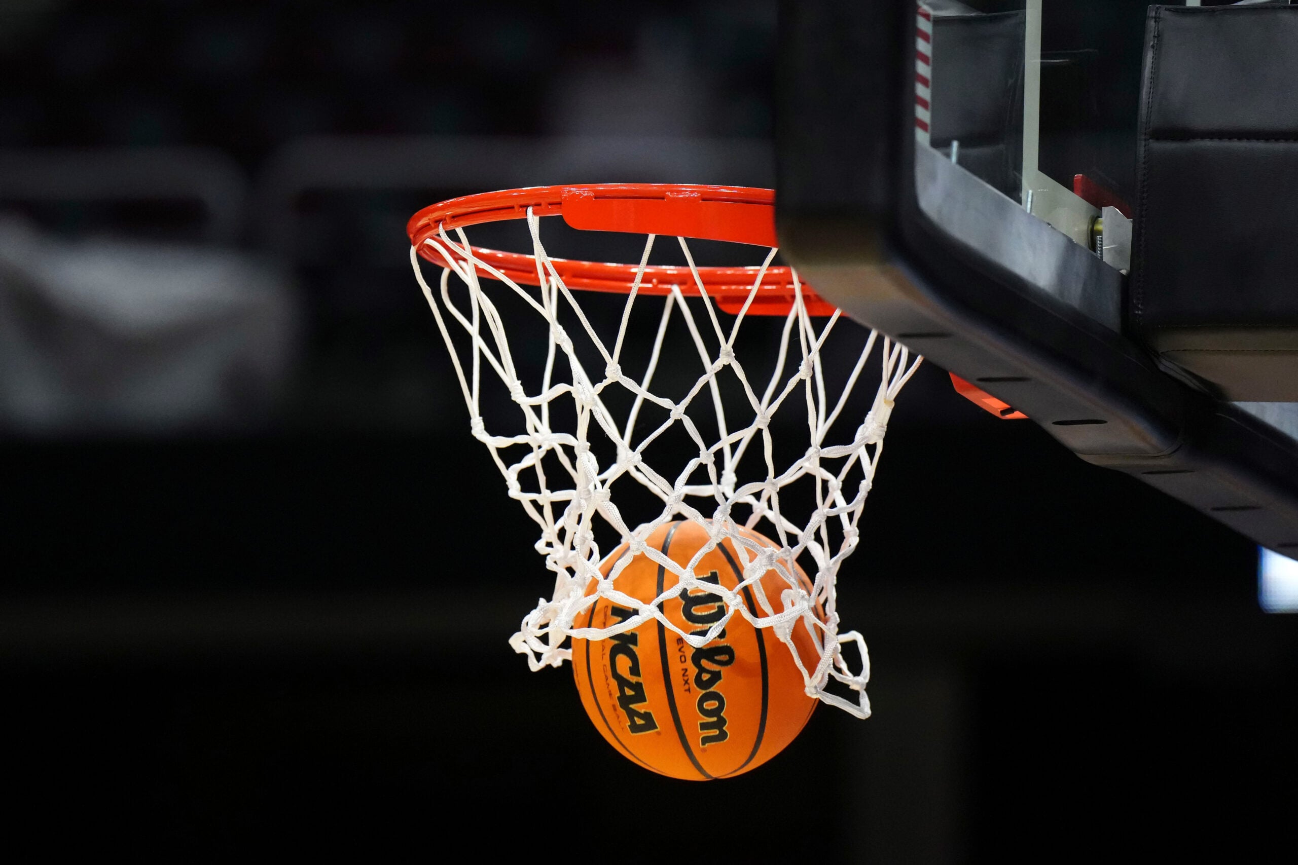 Apr 4, 2024; Cleveland, OH, USA; A Wilson official Evo NXT basketball with the NCAA Women's Final Four March Madness logo approaches the rim and net at Rocket Mortgage FieldHouse. Mandatory Credit: Kirby Lee-Imagn Images