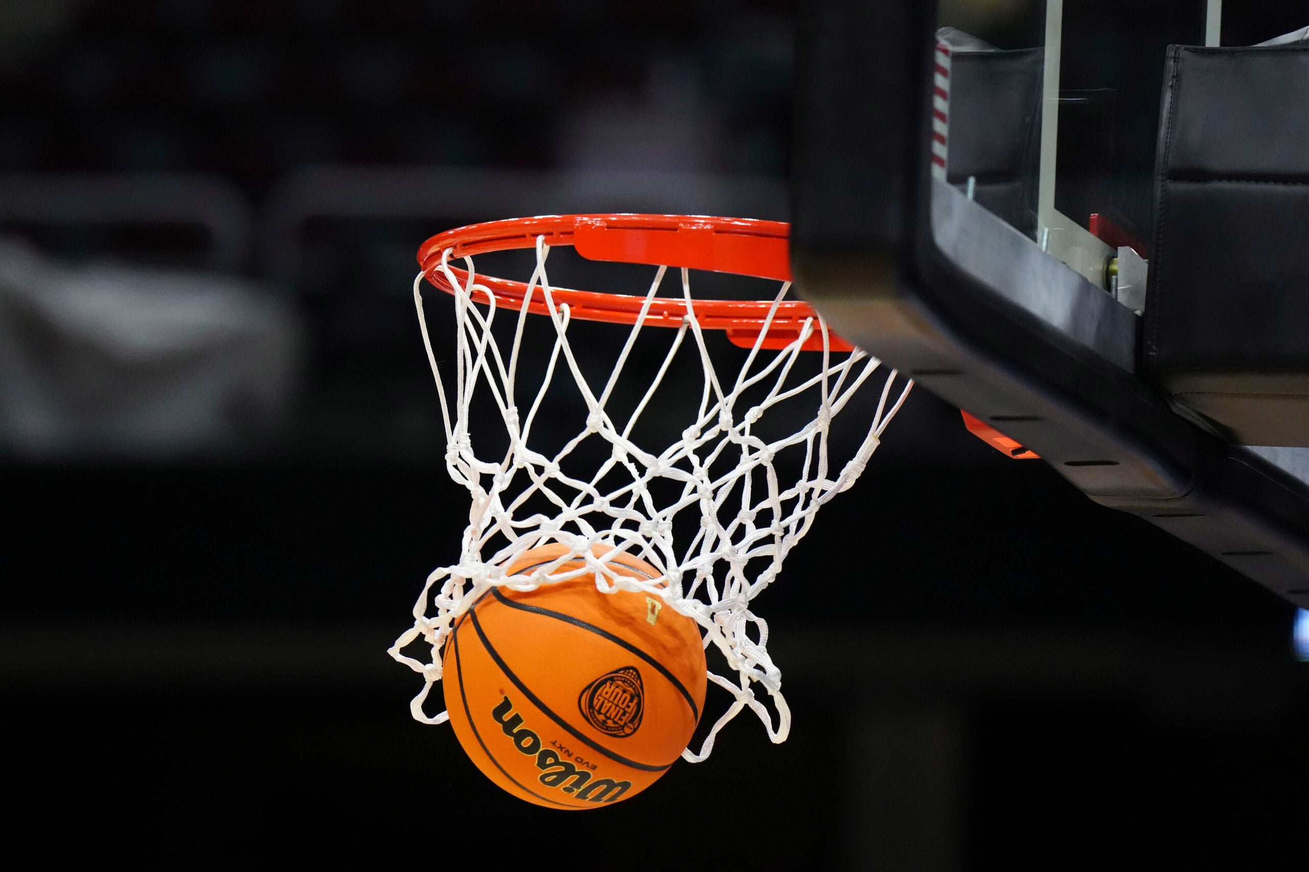 Apr 4, 2024; Cleveland, OH, USA; A Wilson official Evo NXT basketball with the NCAA Women's Final Four March Madness logo approaches the rim and net at Rocket Mortgage FieldHouse. Mandatory Credit: Kirby Lee-Imagn Images