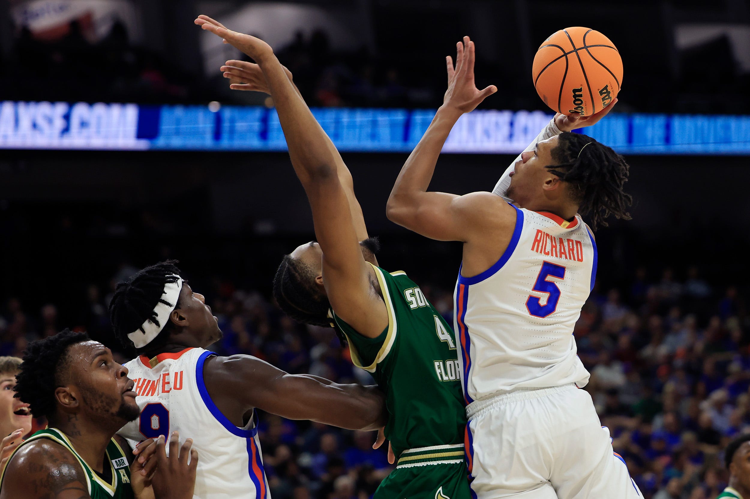 Florida Gators guard Will Richard (5) shoots over South Florida Bulls guard Kobe Knox (4) during the first half of an NCAA men’s basketball matchup Monday, Nov. 4, 2024 at VyStar Veterans Memorial Arena in Jacksonville, Fla. [Corey Perrine/Florida Times-Union]