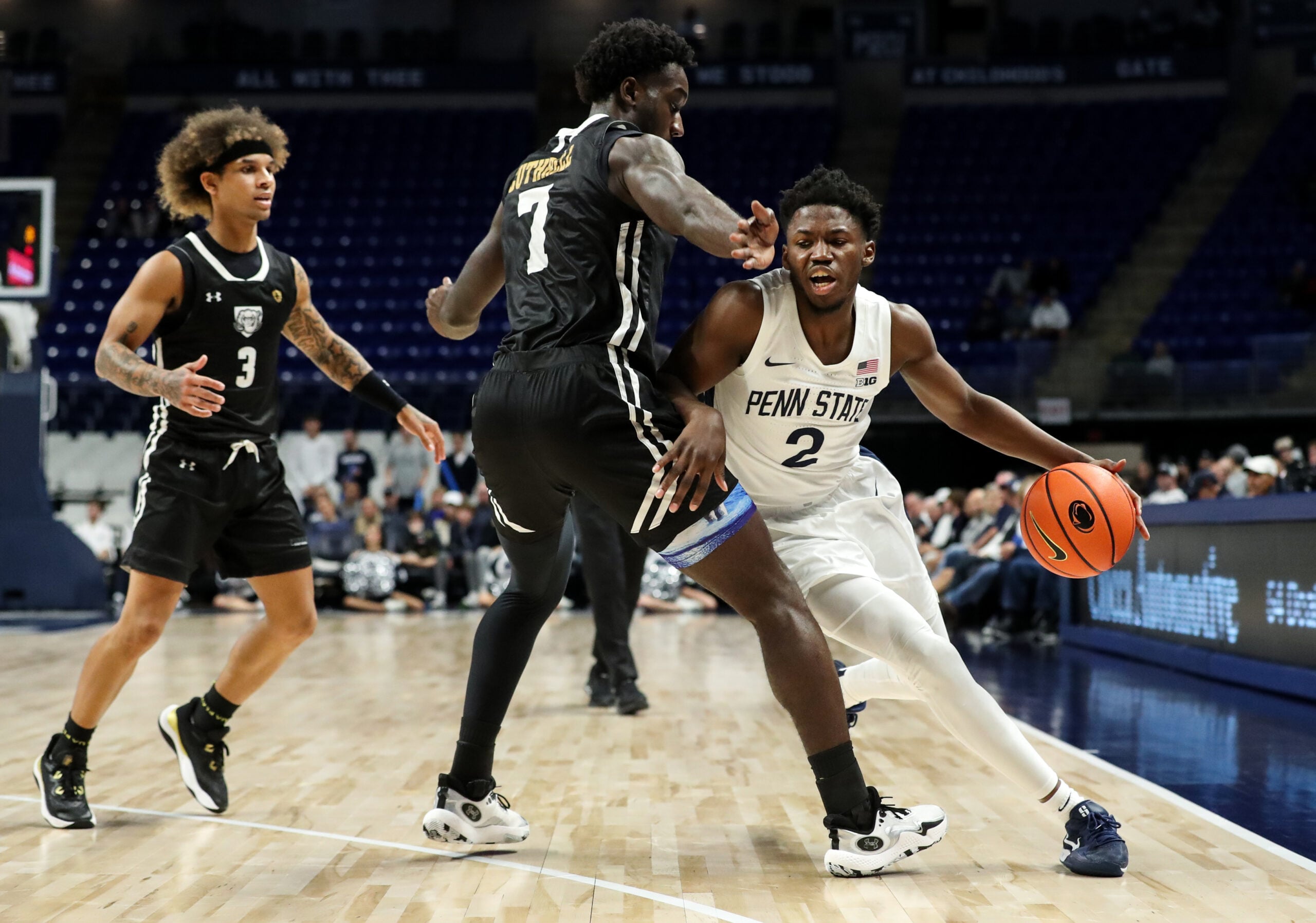 Nov 20, 2024; University Park, Pennsylvania, USA; Penn State Nittany Lions guard D'Marco Dunn (2) attempts to dribble the ball around Purdue Fort Wayne Mastodons forward Chandler Cuthrell (7) during the first half at Bryce Jordan Center. Mandatory Credit: Matthew O'Haren-Imagn Images