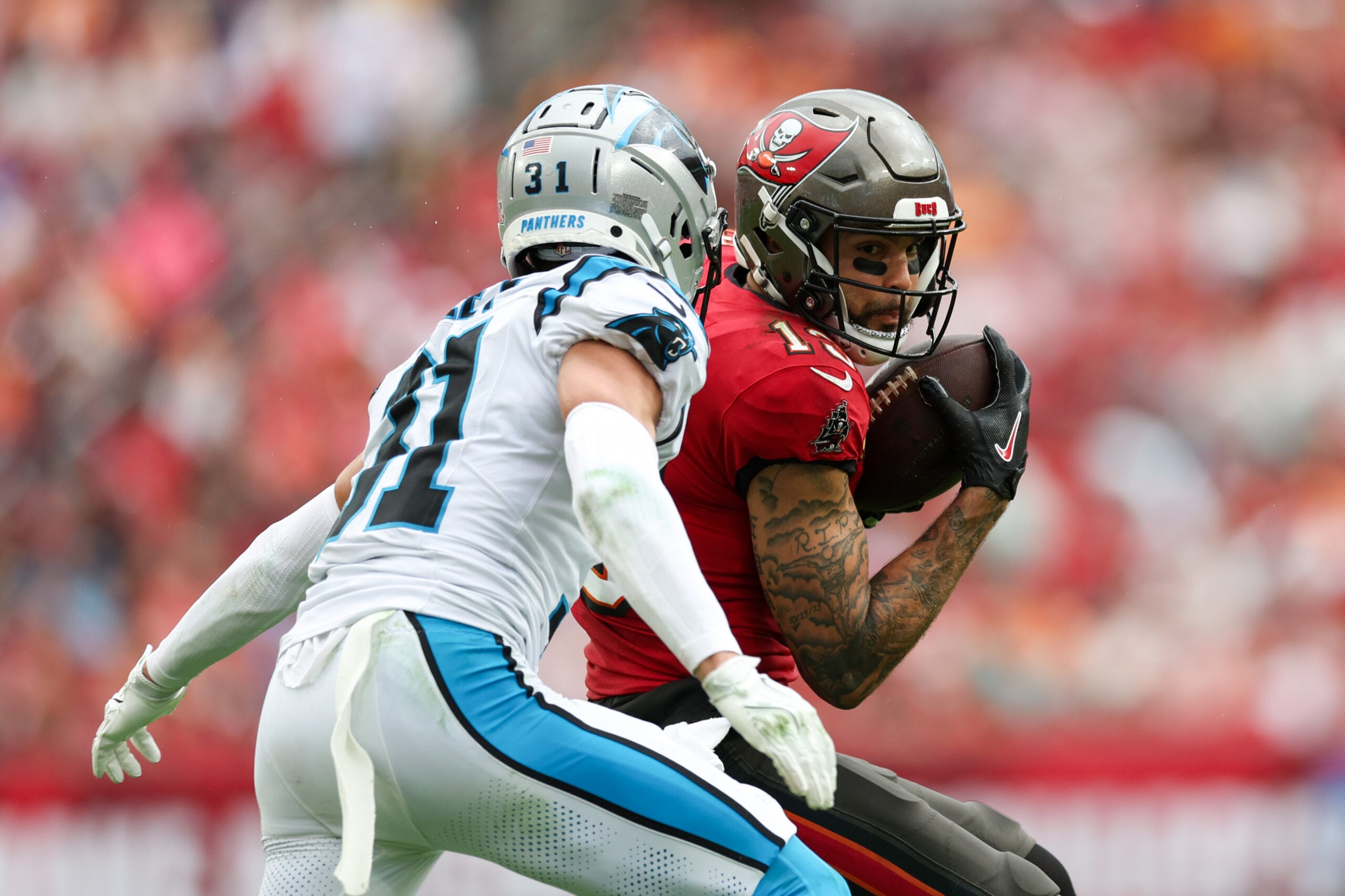 Dec 29, 2024; Tampa, Florida, USA; Tampa Bay Buccaneers wide receiver Mike Evans (13) runs with the ball against the Carolina Panthers in the fourth quarter at Raymond James Stadium. Mandatory Credit: Nathan Ray Seebeck-Imagn Images