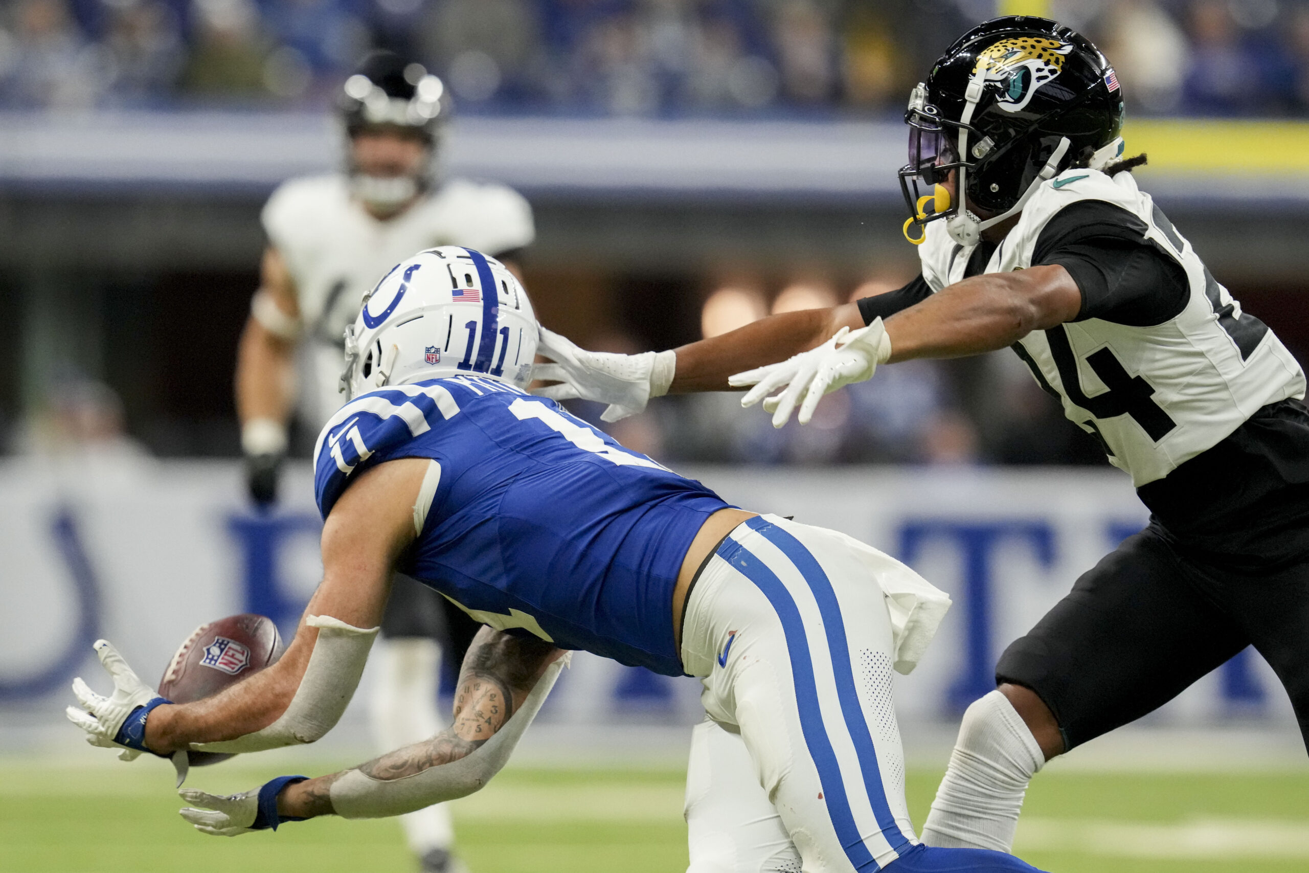 Jan 5, 2025; Indianapolis, Indiana, USA; A pass intended for Indianapolis Colts wide receiver Michael Pittman Jr. (11) falls incomplete during a game against the Jacksonville Jaguars at Lucas Oil Stadium. Mandatory Credit: Christine Tannous/USA TODAY Network via Imagn Images
