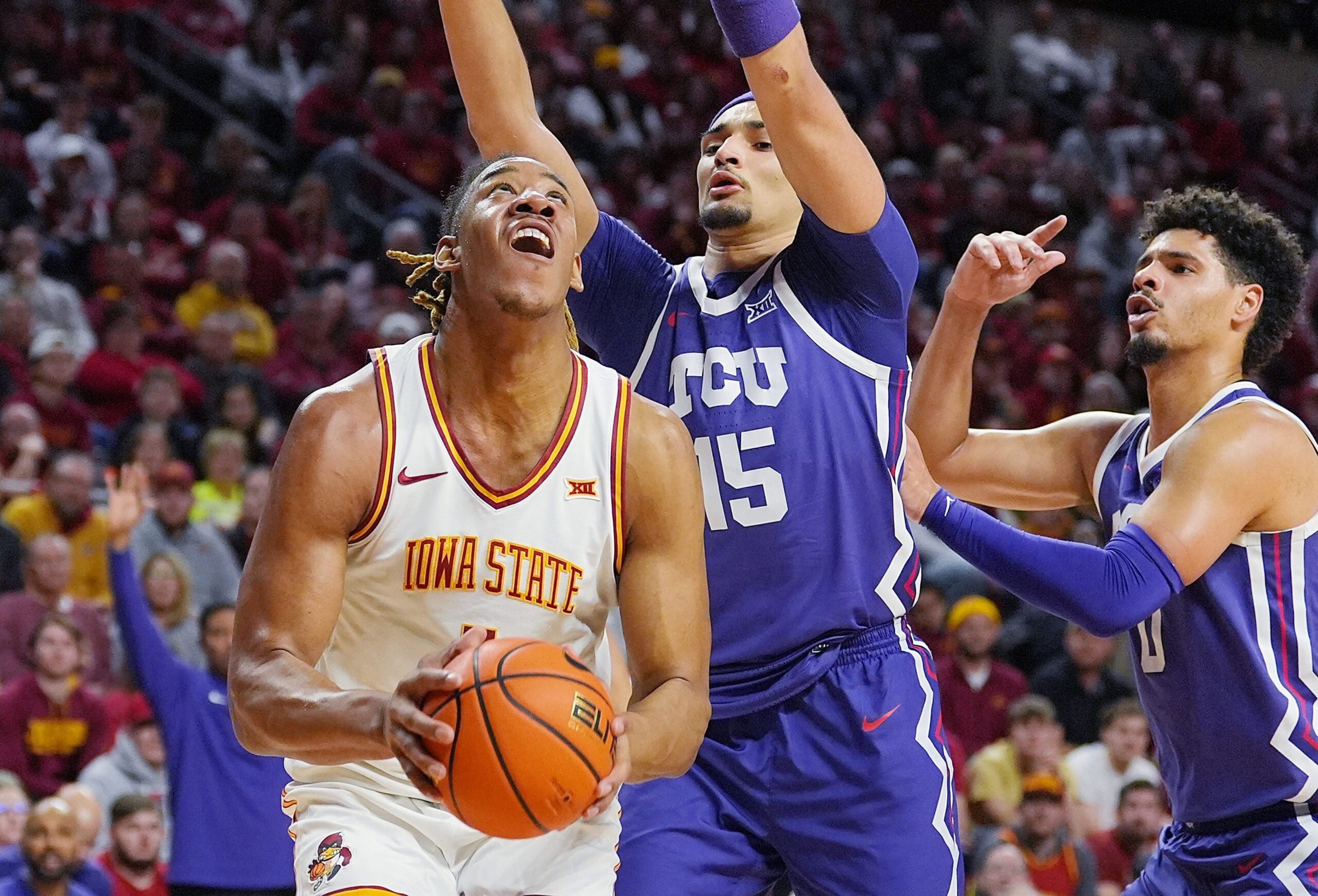 Iowa State Cyclones center Dishon Jackson (1) looks for a short around TCU Horned Frogs center David Punch (15) during the first half in the Big-12 men’s basketball at Hilton Coliseum on Feb 8, 2025 in Ames, Iowa.