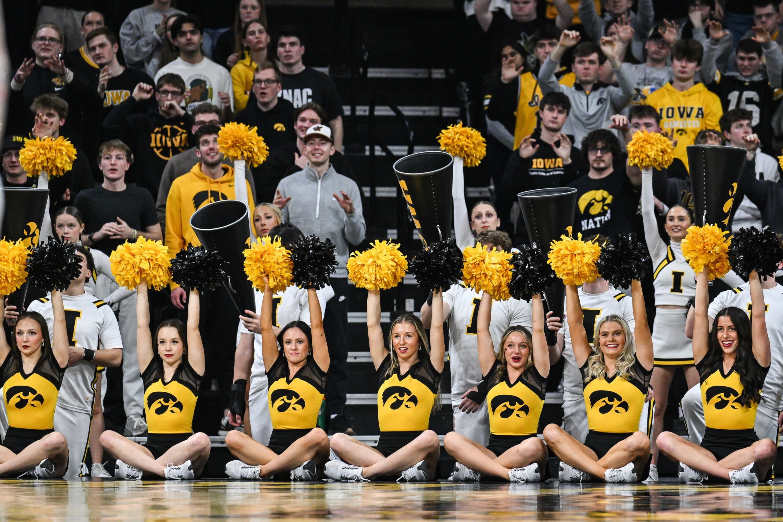 Feb 4, 2025; Iowa City, Iowa, USA; The Iowa Hawkeyes cheerleaders lead the crowd during the second half against the Purdue Boilermakers at Carver-Hawkeye Arena. Mandatory Credit: Jeffrey Becker-Imagn Images