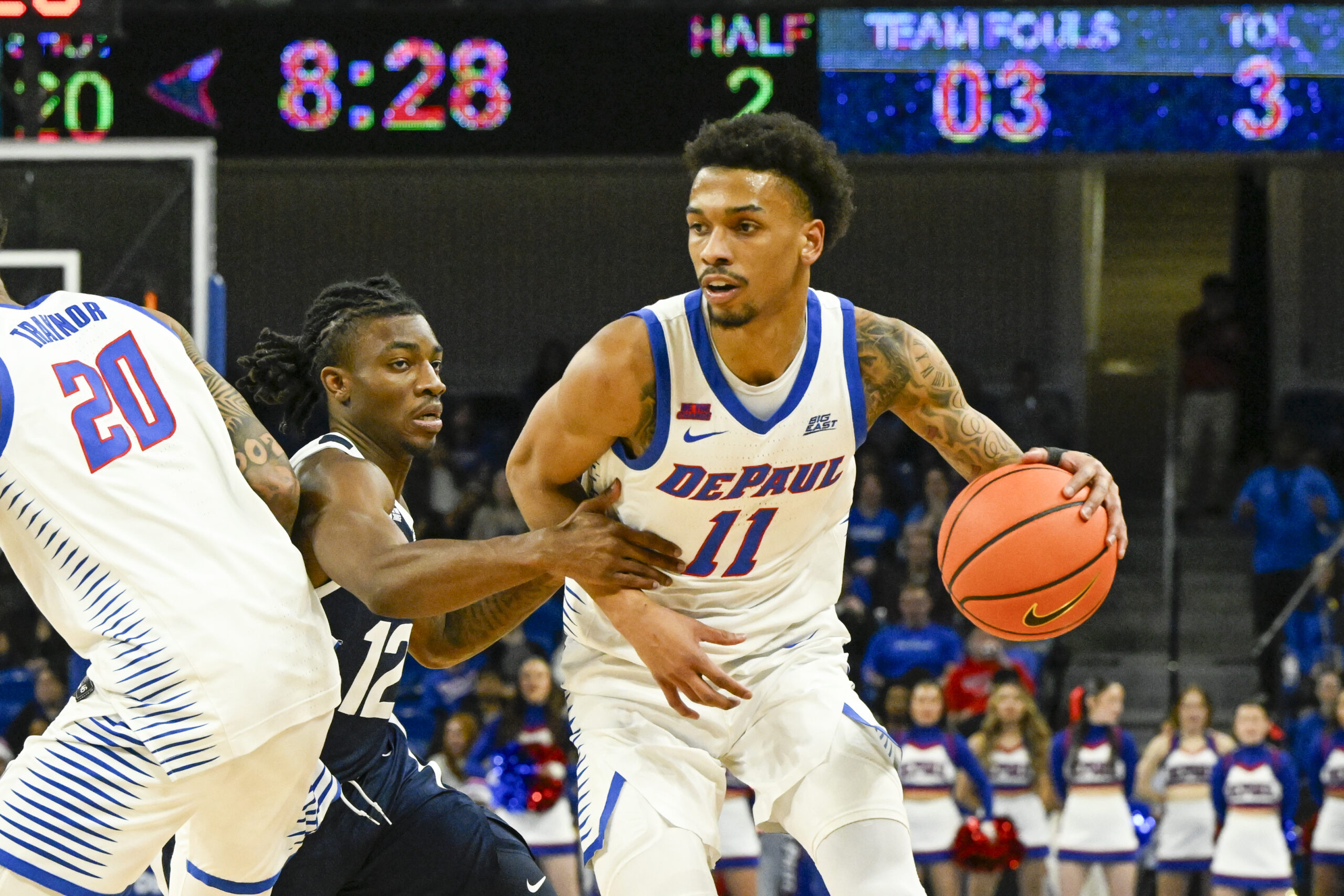 Feb 22, 2025; Chicago, Illinois, USA; DePaul Blue Demons guard CJ Gunn (11) moves the ball against Butler Bulldogs guard Kolby King (12) during the second half at Wintrust Arena. Mandatory Credit: Matt Marton-Imagn Images