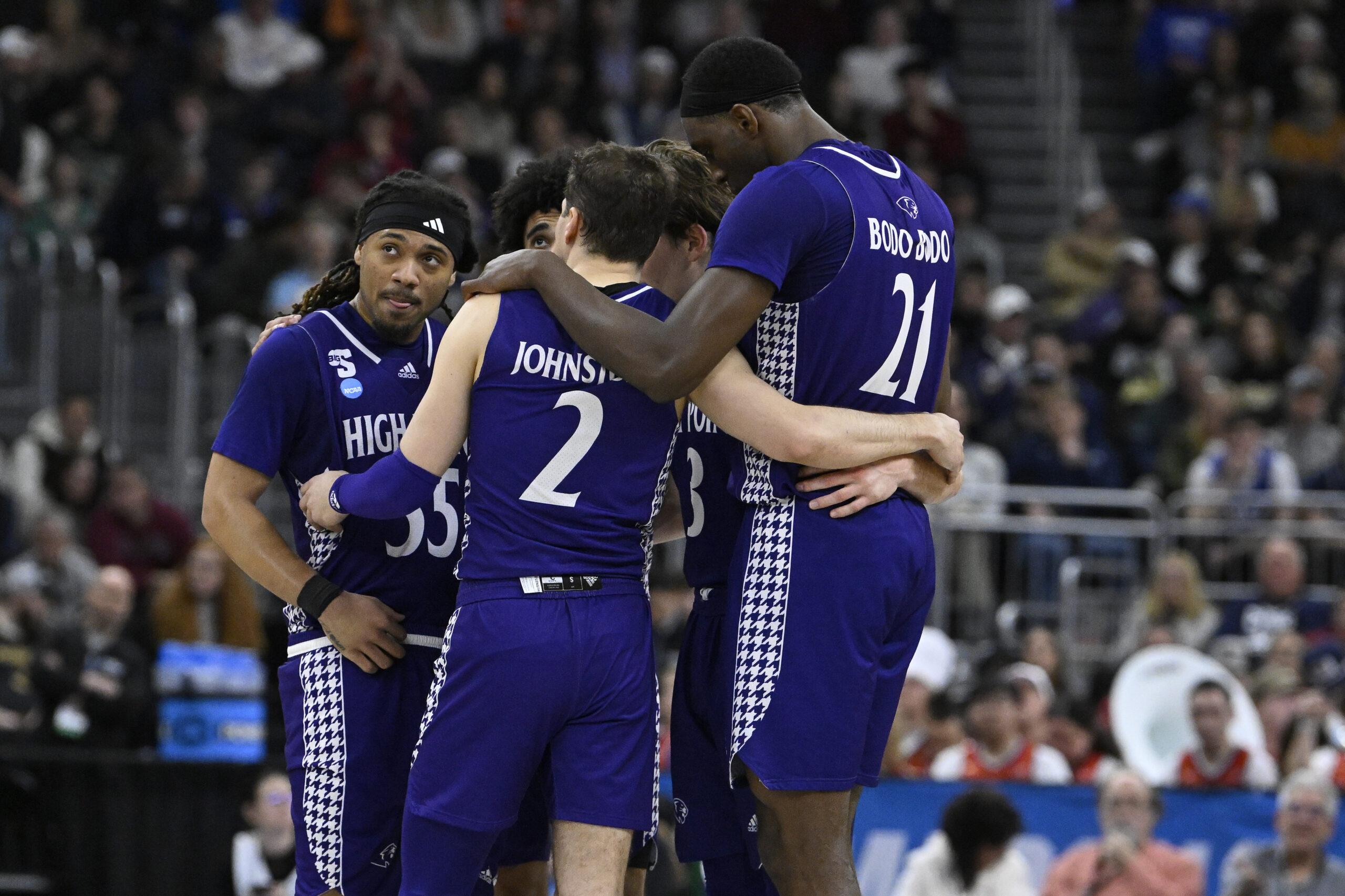 Mar 20, 2025; Providence, RI, USA; High Point Panthers guard Bobby Pettiford (55) and guard Chase Johnston (2) and forward Juslin Bodo Bodo (21) huddle with teammates during the second half against the Purdue Boilermakers at Amica Mutual Pavilion. Mandatory Credit: Eric Canha-Imagn Images