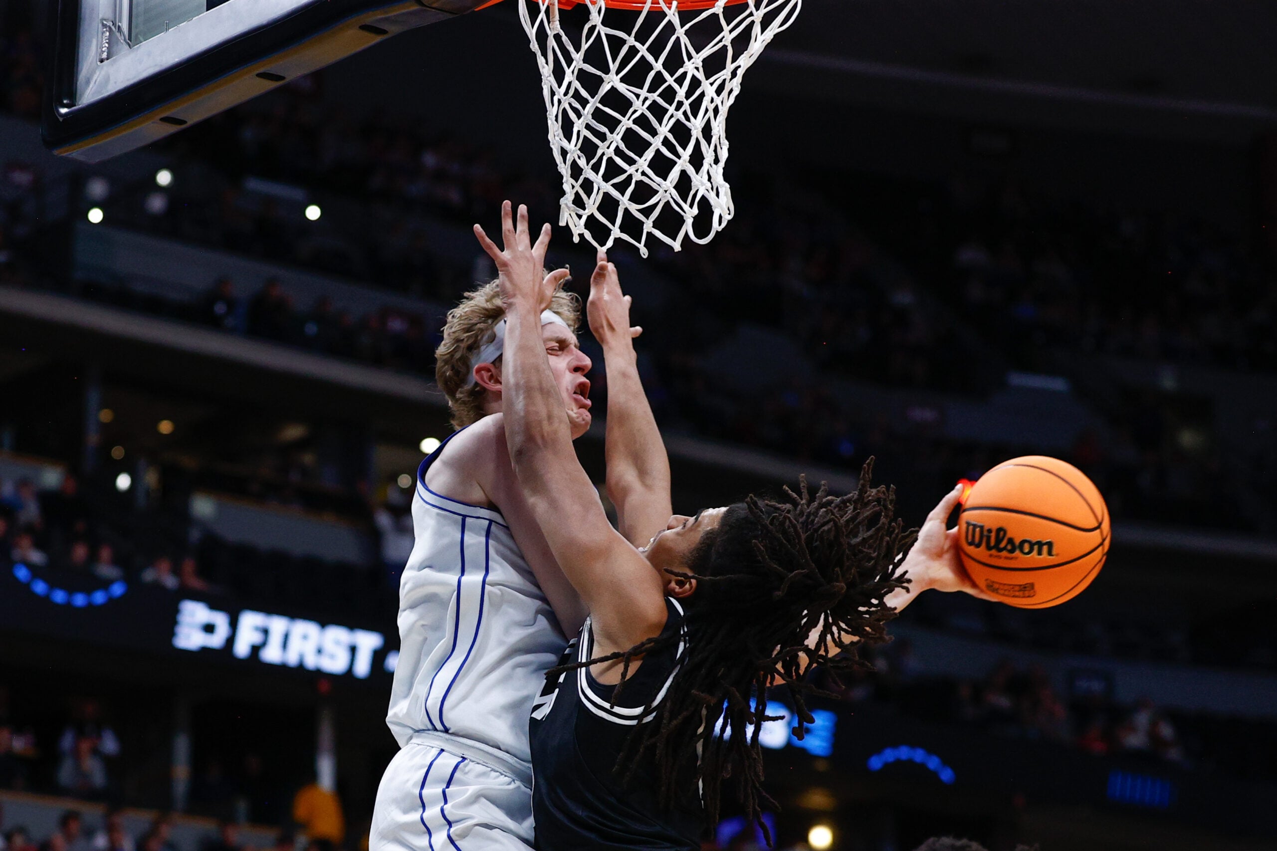 Mar 20, 2025; Denver, CO, USA; Brigham Young Cougars forward Richie Saunders (15) passes the ball away from VCU Rams guard Brandon Jennings (0) during the second half in the first round of the NCAA Tournament at Ball Arena. Mandatory Credit: Isaiah J. Downing-Imagn Images