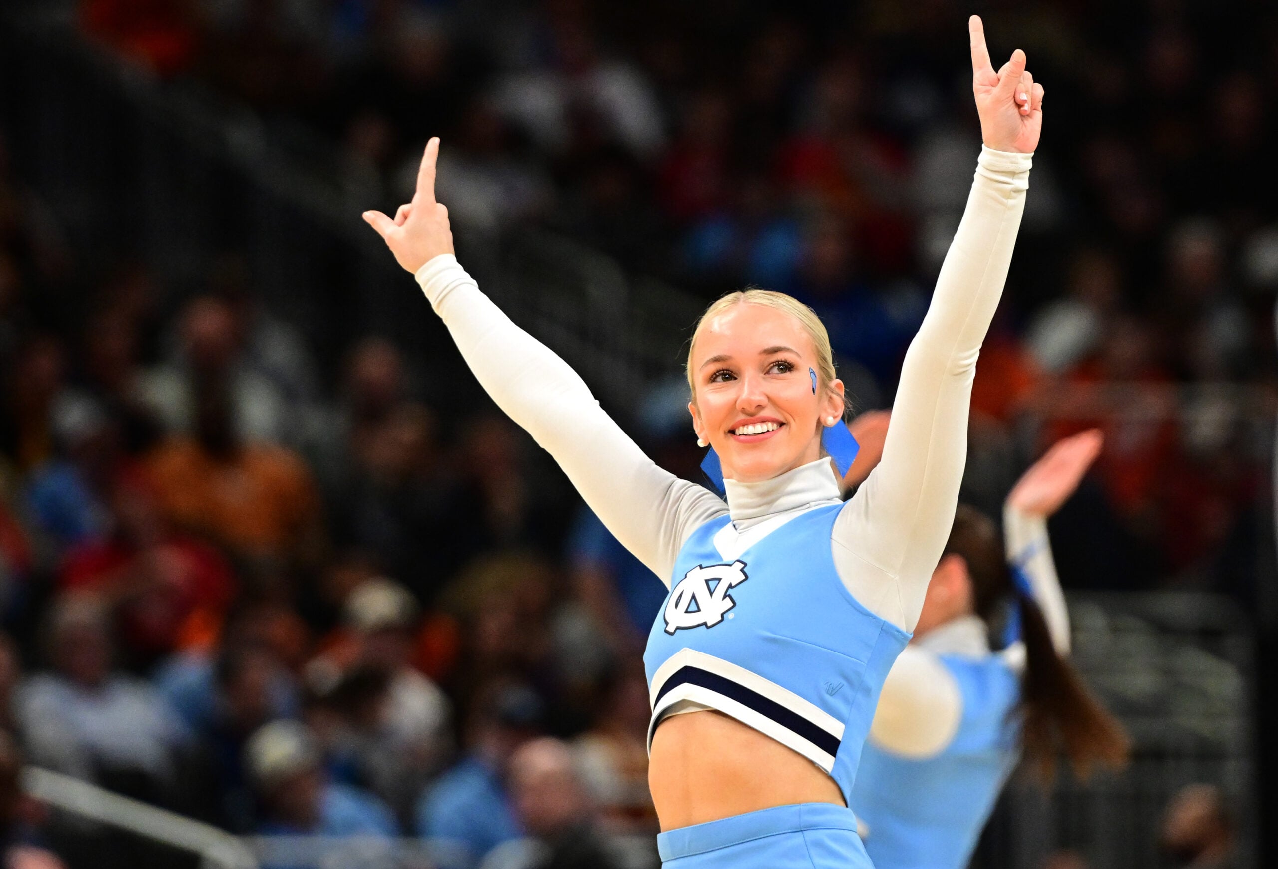 Mar 21, 2025; Milwaukee, WI, USA; Cheerleaders for the North Carolina Tar Heels during the first half of a first round NCAA men’s tournament game against the Mississippi Rebels at Fiserv Forum. Mandatory Credit: Benny Sieu-Imagn Images