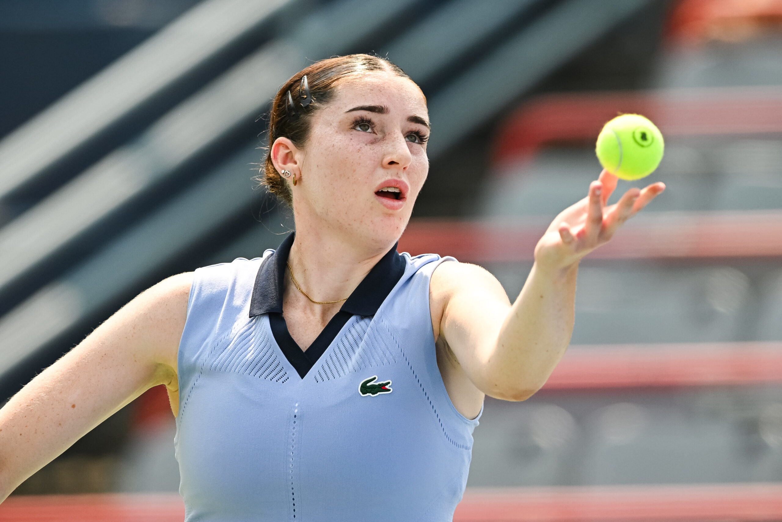 Jul 26, 2025; Montreal, QC, Canada; Elsa Jacquemot (FRA) serves the ball to Carol Zhao (CAN) (not pictured) in qualifying play at IGA Stadium. Mandatory Credit: David Kirouac-Imagn Images