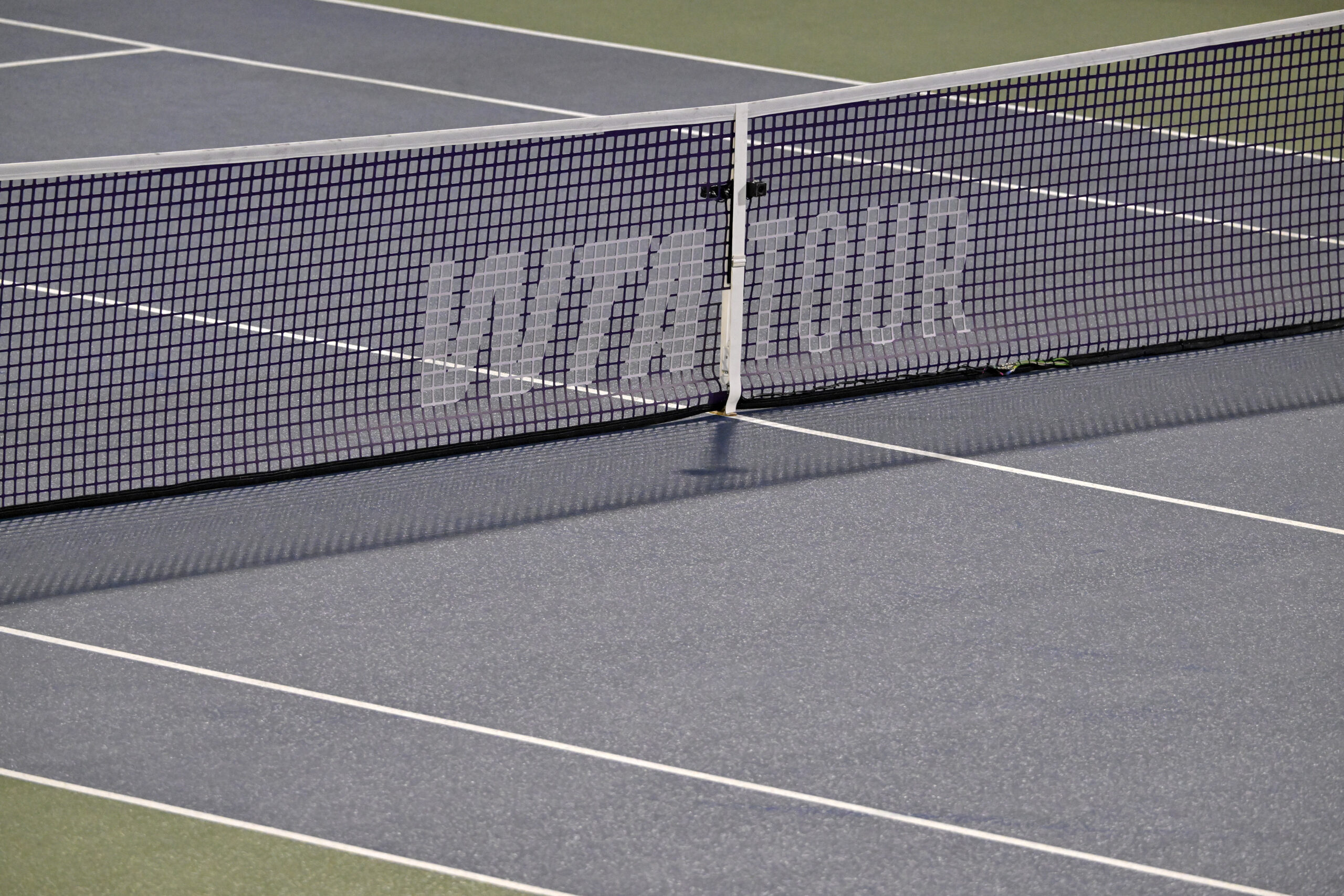 Aug 2, 2025; Montreal, QC, Canada; Rain delay on centre court and the WTA logo on the net during the match between Jessica Bouzas Maneiro (ESP) and Lin Zhu (CHN) in fourth round play at IGA Stadium. Mandatory Credit: Eric Bolte-Imagn Images
