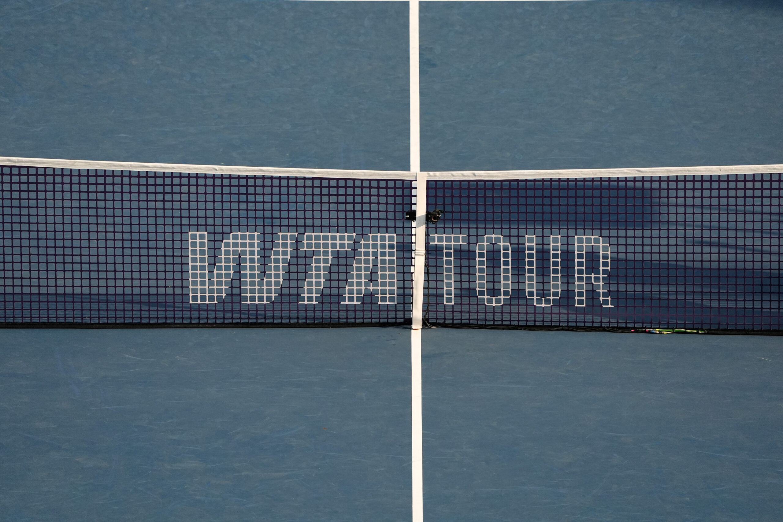 Aug 6, 2025; Montreal, QC, Canada;Tennis net with WTA tour logo during the Victoria Mboko (CAN) and Elena Rybakina (KAZ) match in semifinal play at IGA Stadium. Mandatory Credit: Eric Bolte-Imagn Images