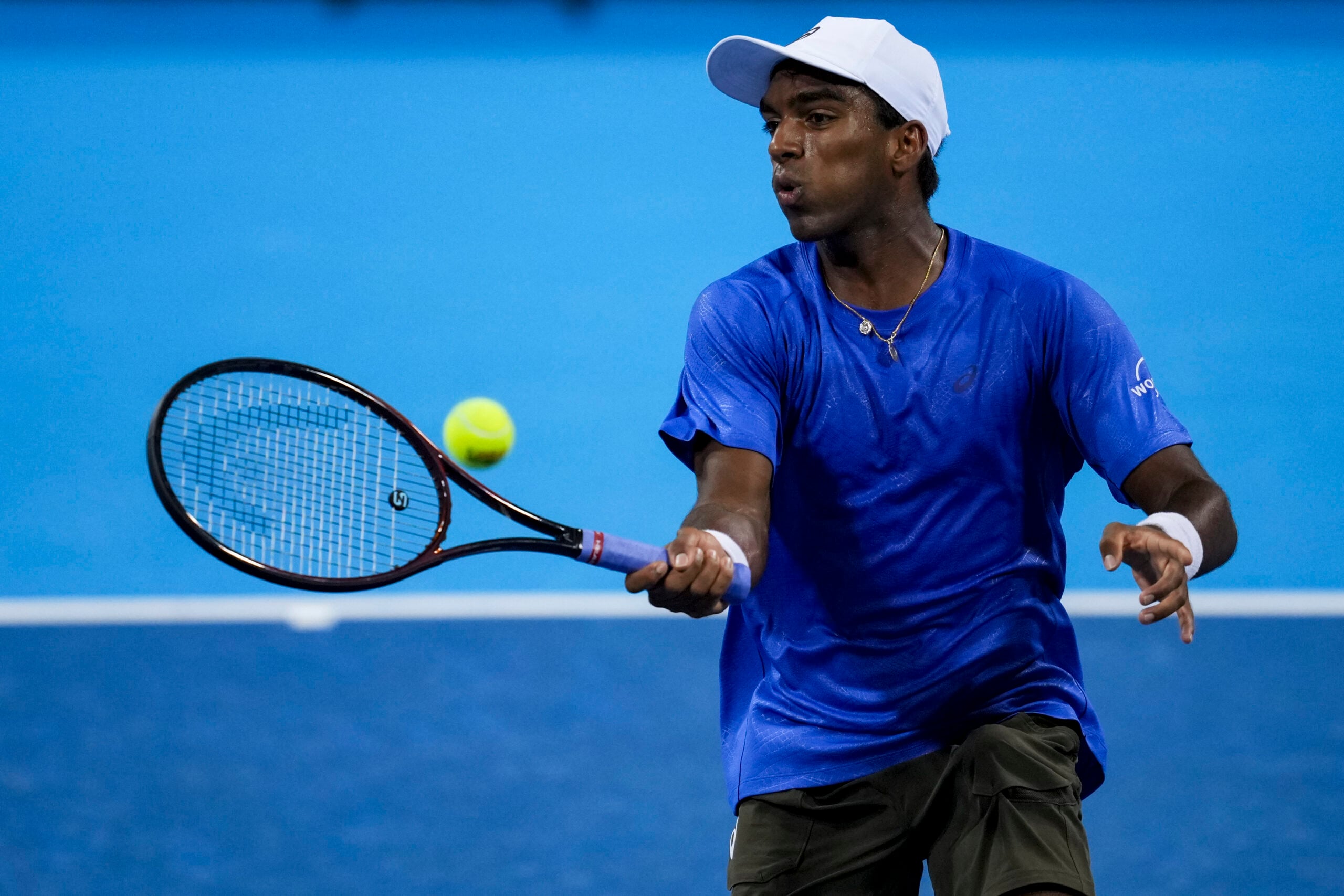 Aug 10, 2025; Cincinnati, OH, USA; Nishesh Basavareddy (USA) returns a shot against Alexander Zverev (GER) during the Cincinnati Open at the Lindner Family Tennis Center. Mandatory Credit: Aaron Doster-Imagn Images