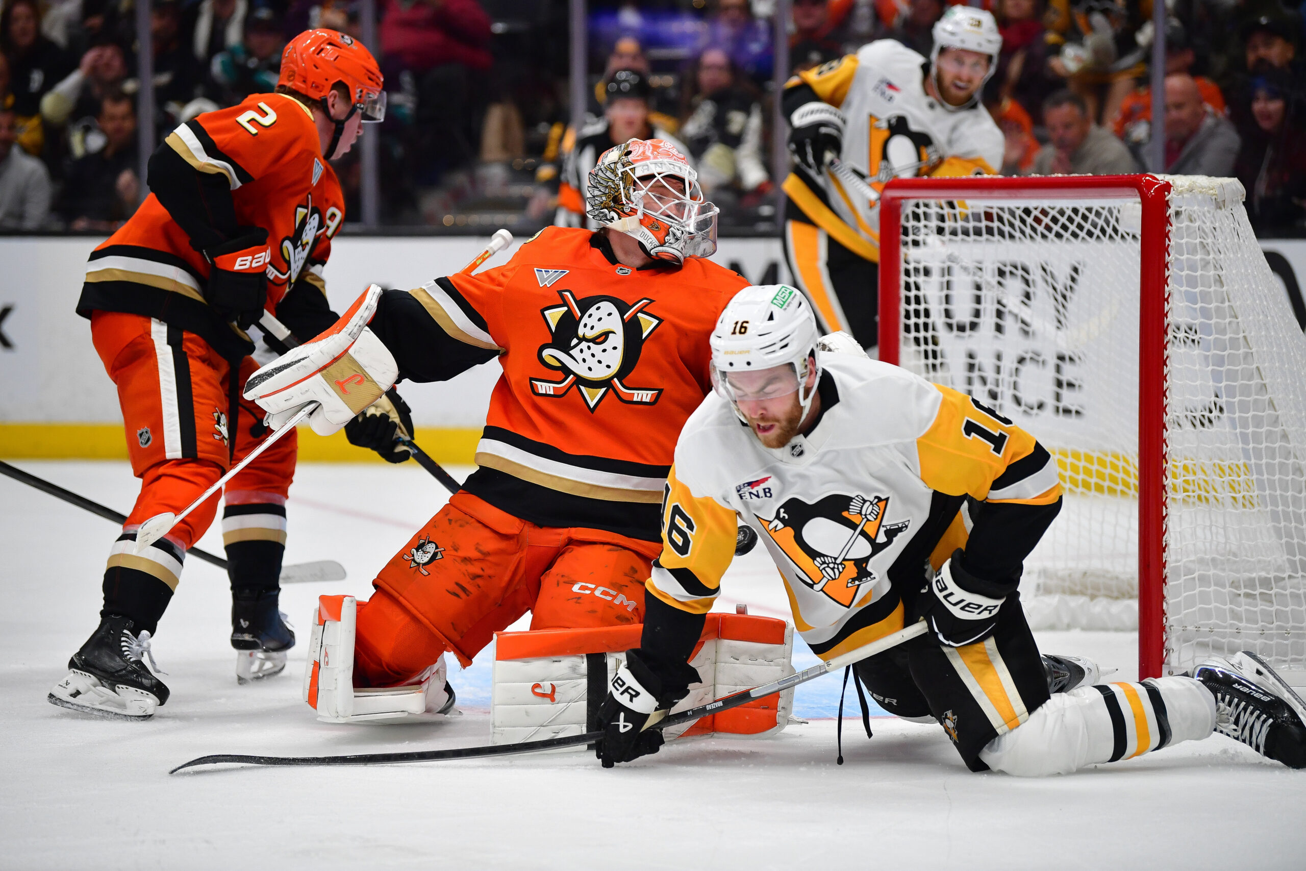 Oct 14, 2025; Anaheim, California, USA; Anaheim Ducks goaltender Lukas Dostal (1) defends the goal against Pittsburgh Penguins right wing Justin Brazeau (16) during the third period at Honda Center. Mandatory Credit: Gary A. Vasquez-Imagn Images