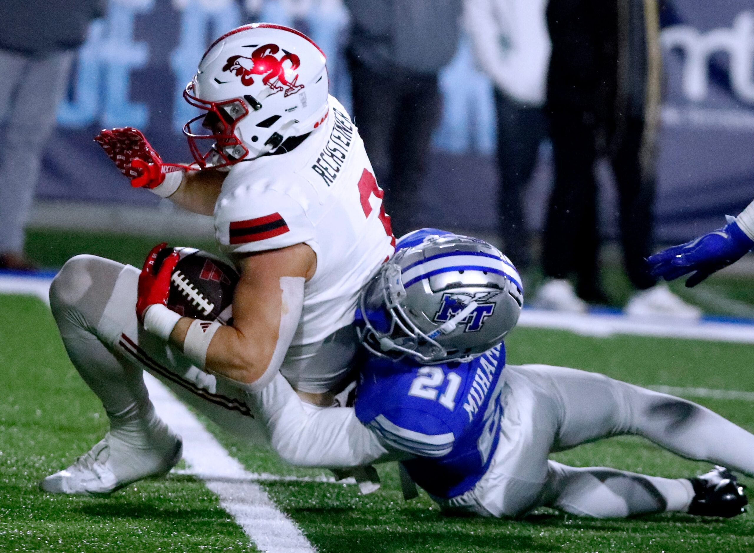 Jacksonville State wide receiver Brock Rechsteiner (3) carries the ball as Middle Tennessee cornerback Abdul Muhammad (21) makes the stop during the football game, at MTSU on Wednesday, October 29, 2025.