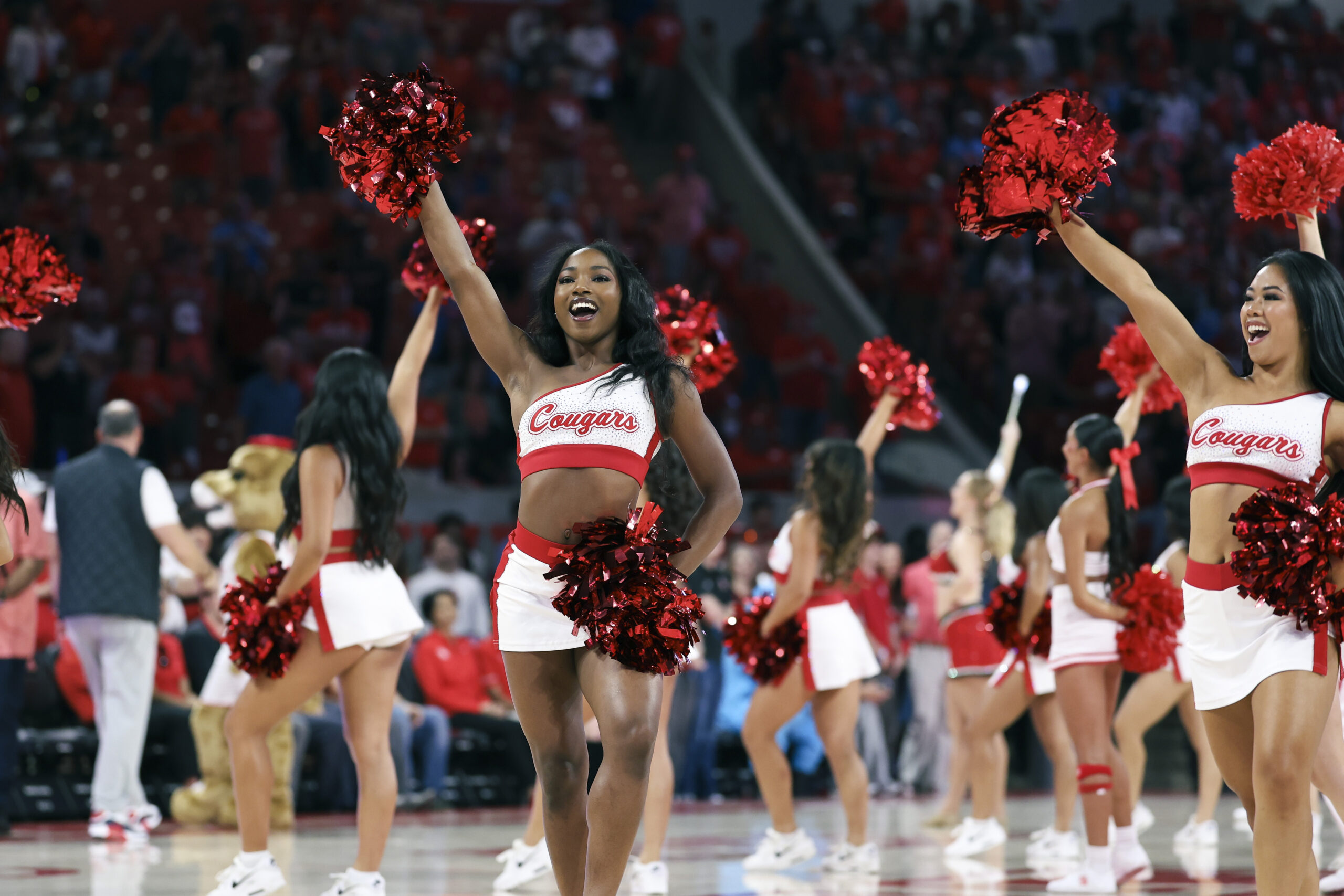 Nov 8, 2025; Houston, Texas, USA; Houston Cougars cheerleaders perform before the game against the Towson Tigers at Fertitta Center. Mandatory Credit: Troy Taormina-Imagn Images